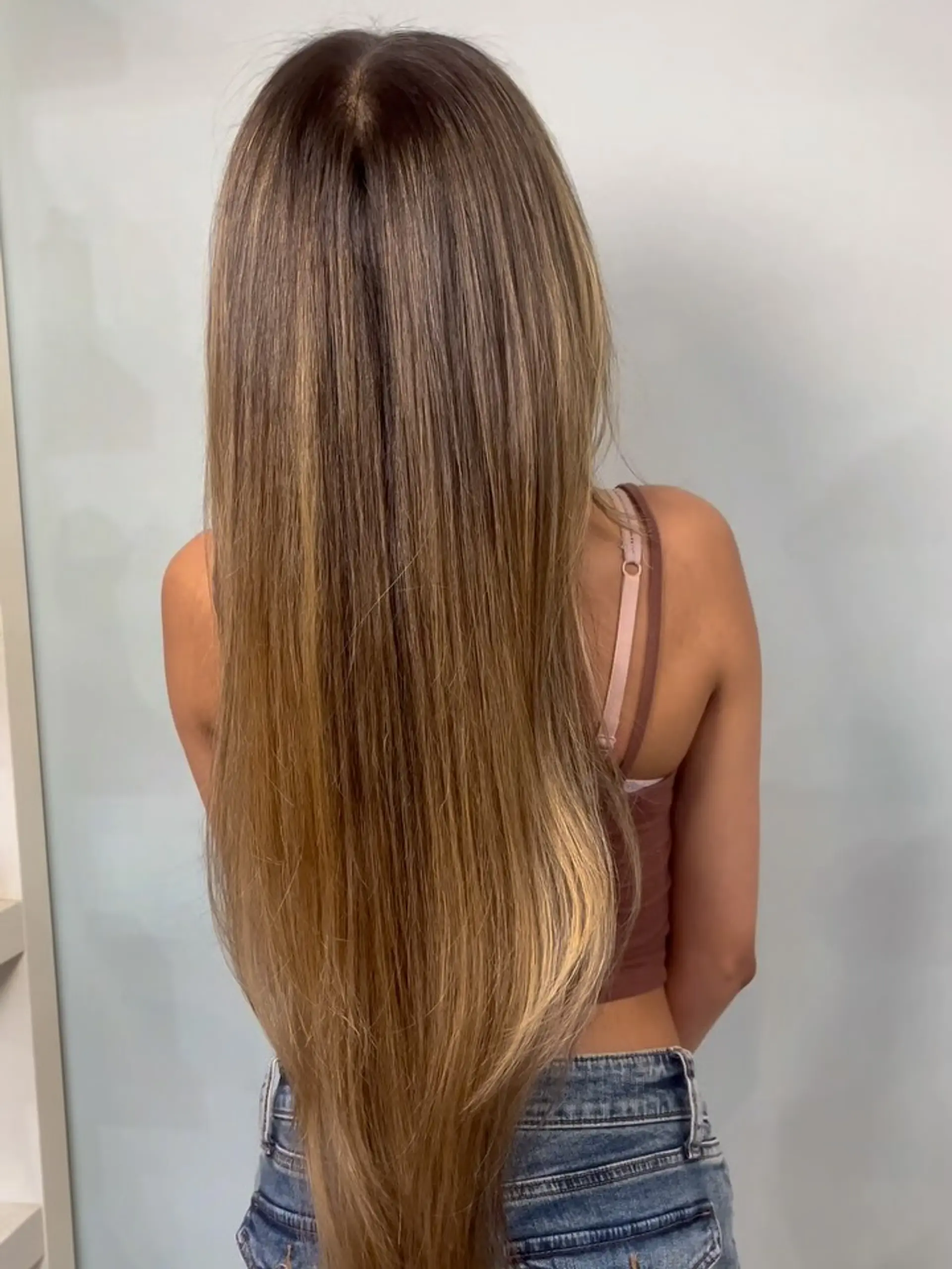Extra-long straight honey golden blonde balayage seamlessly blended from a natural root into warm golden tones. 1