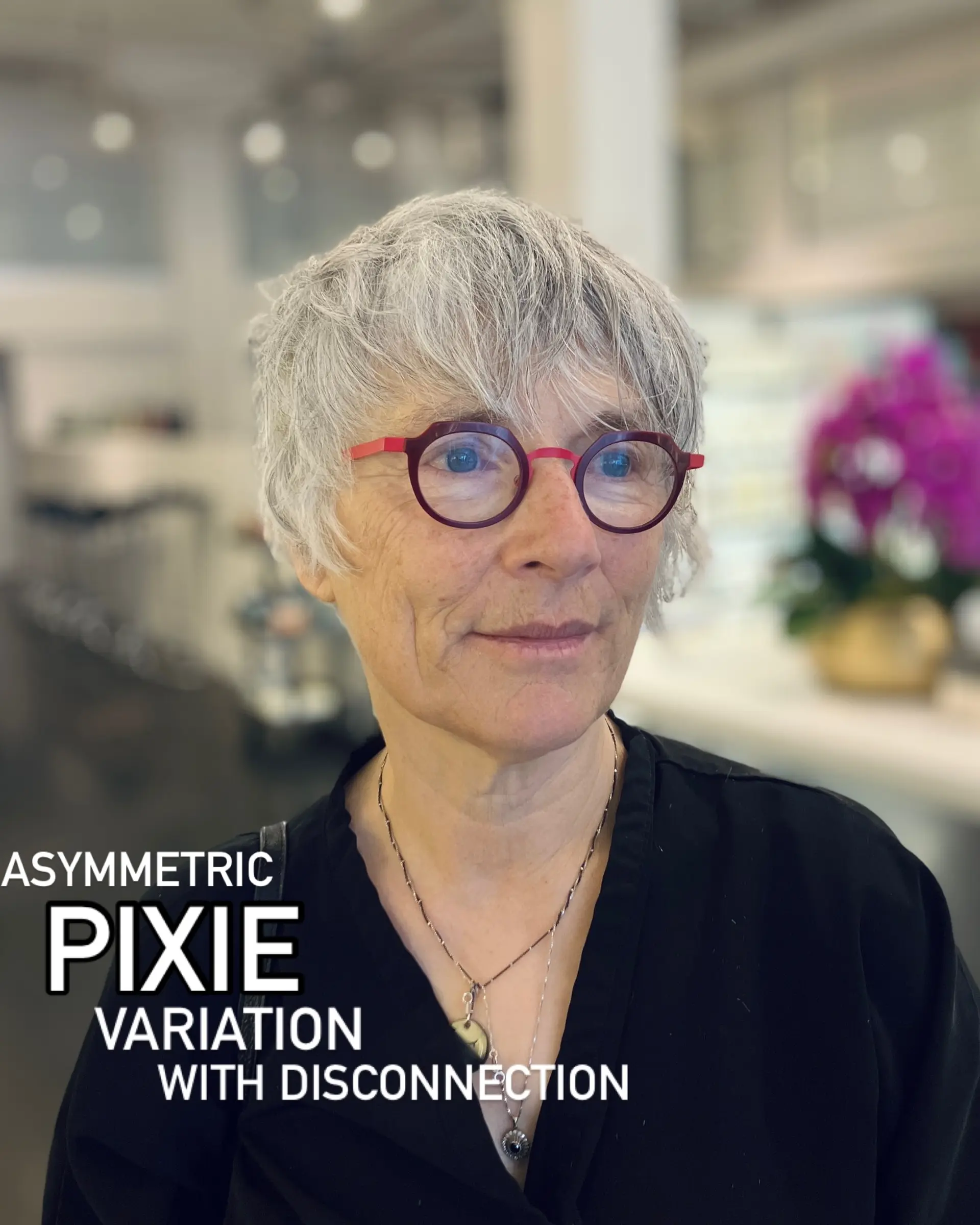 A textured asymmetrical pixie cut with disconnected layers and soft, wispy fringe in natural silver-grey tones. 1