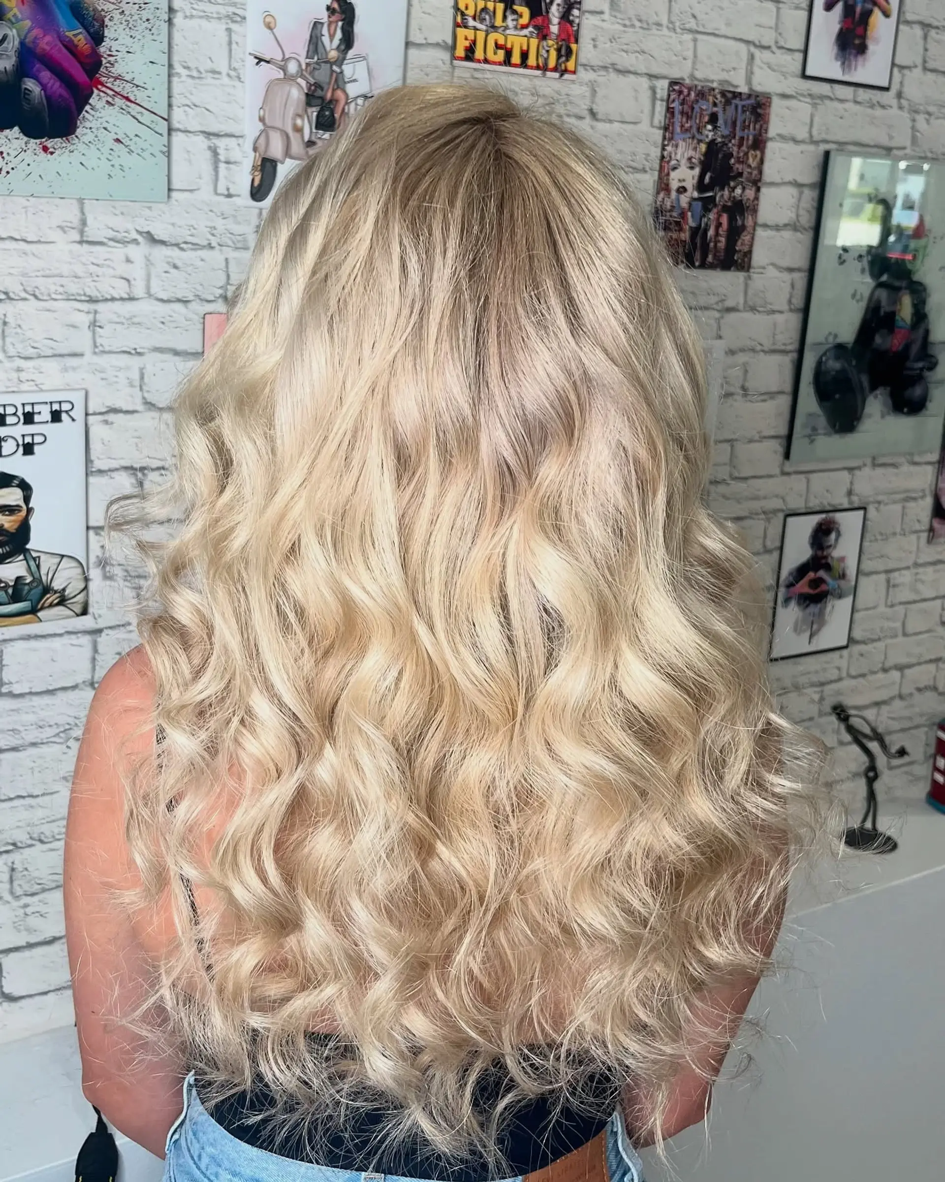 A long, wavy hairstyle featuring beautiful beach waves. The style is loose and relaxed, perfect for a casual yet chic look. 1