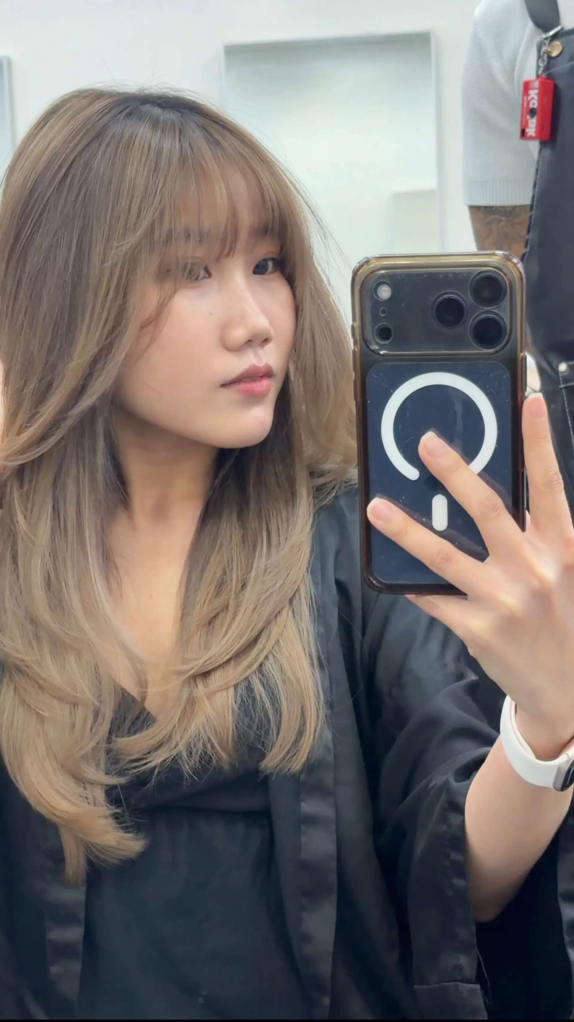 Long, layered ash brown hair with soft wispy bangs and an inward curved blowout. 1