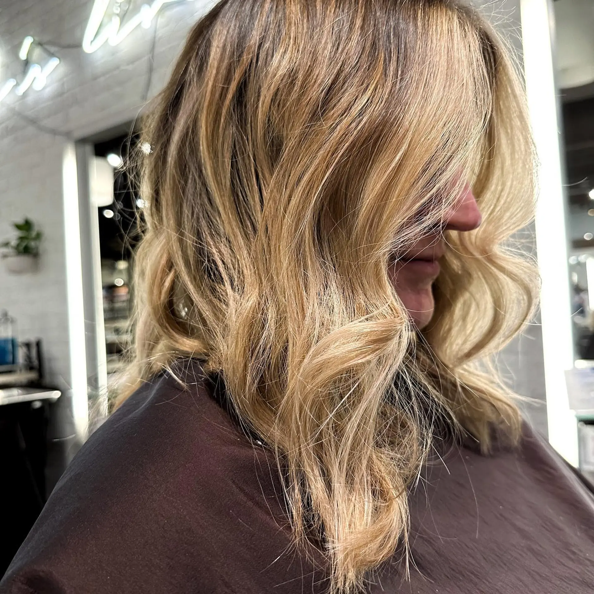 A wavy lob with a blonde balayage. 1
