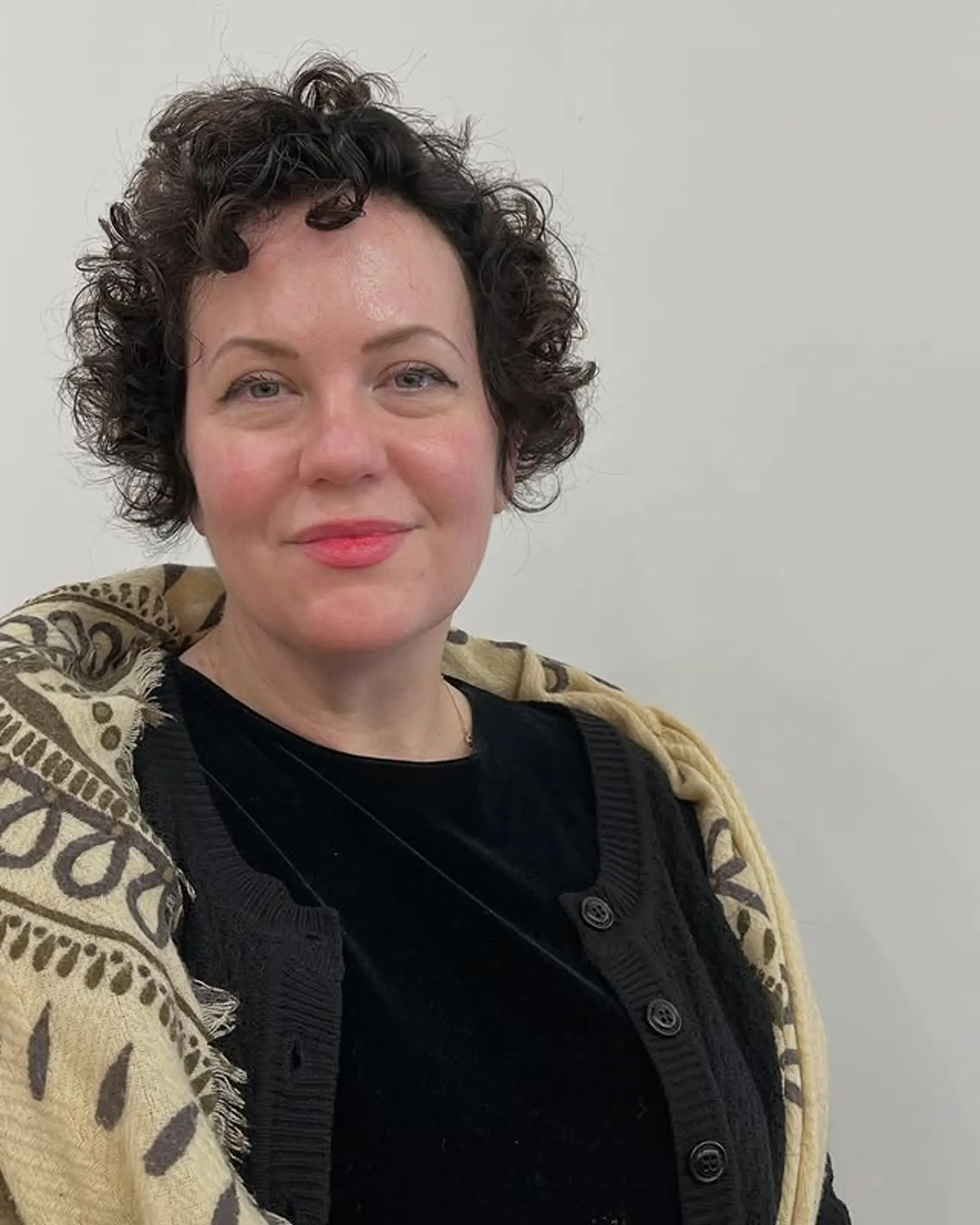 A short, curly bob with natural, defined curls. 1