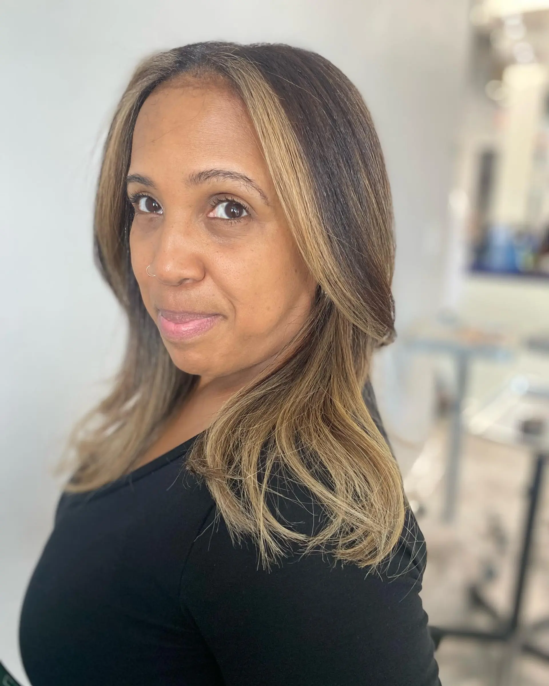 A long, layered hairstyle with face-framing highlights for added dimension. 1