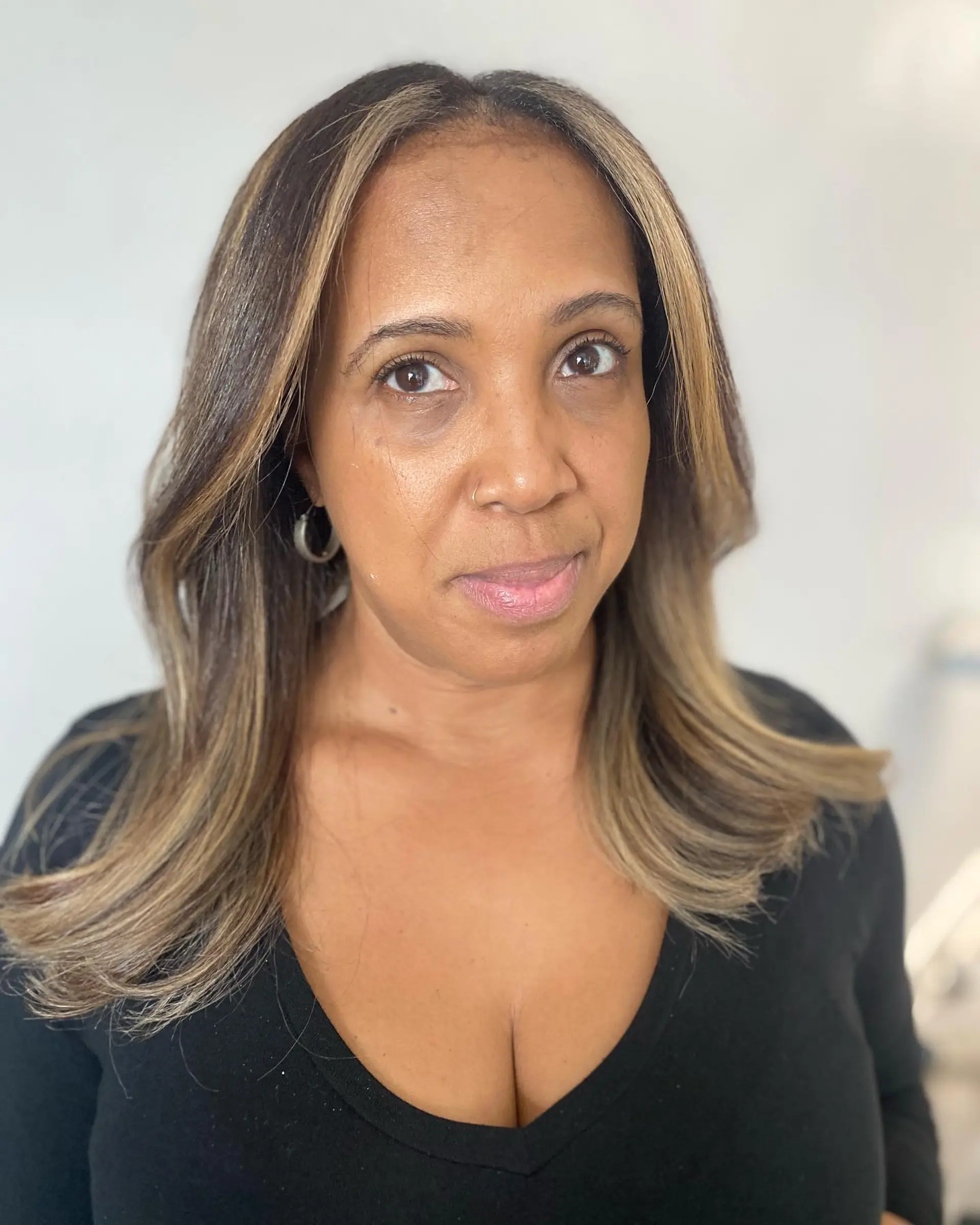 A long, layered hairstyle with face-framing highlights for added dimension. 3