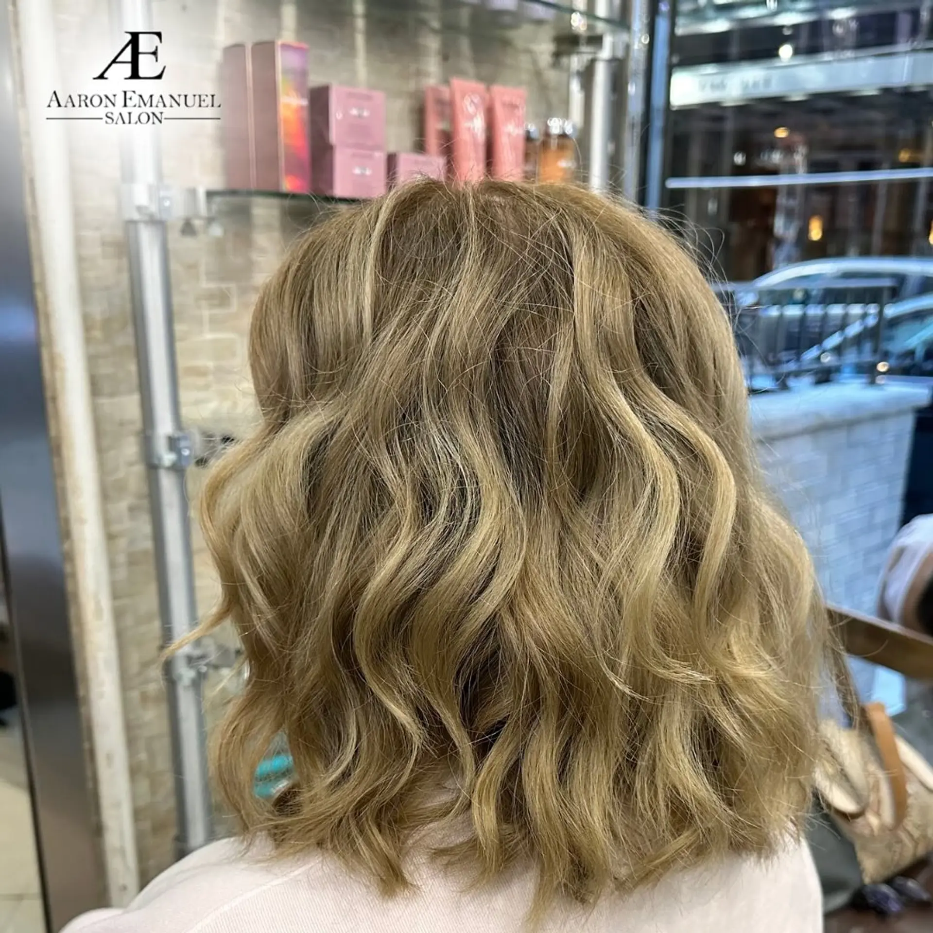 A wavy lob hairstyle with natural, soft waves and subtle layering for movement. 1
