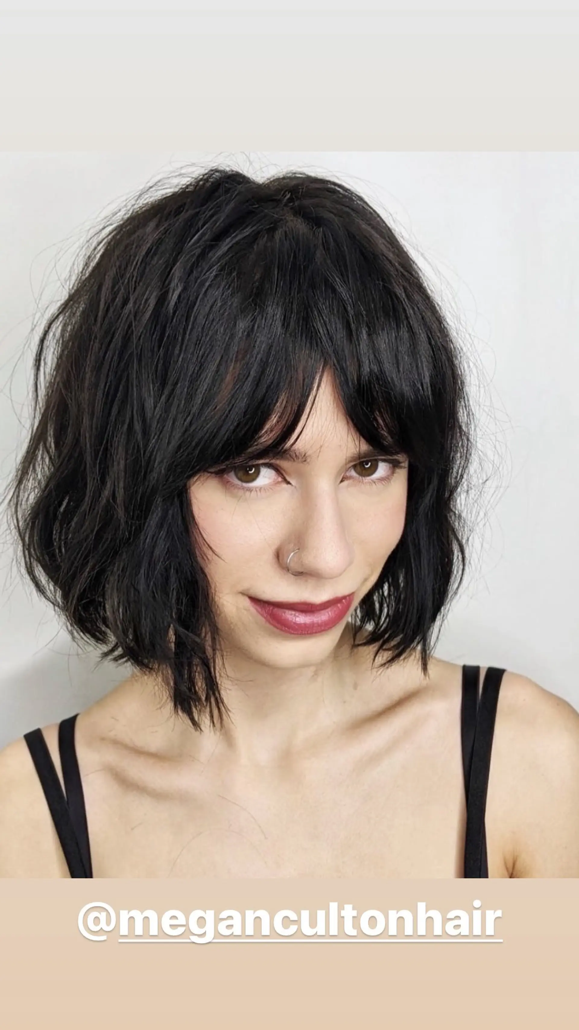 A trendy shaggy bob with choppy layers and fringe bangs, perfect for adding texture and movement. 1