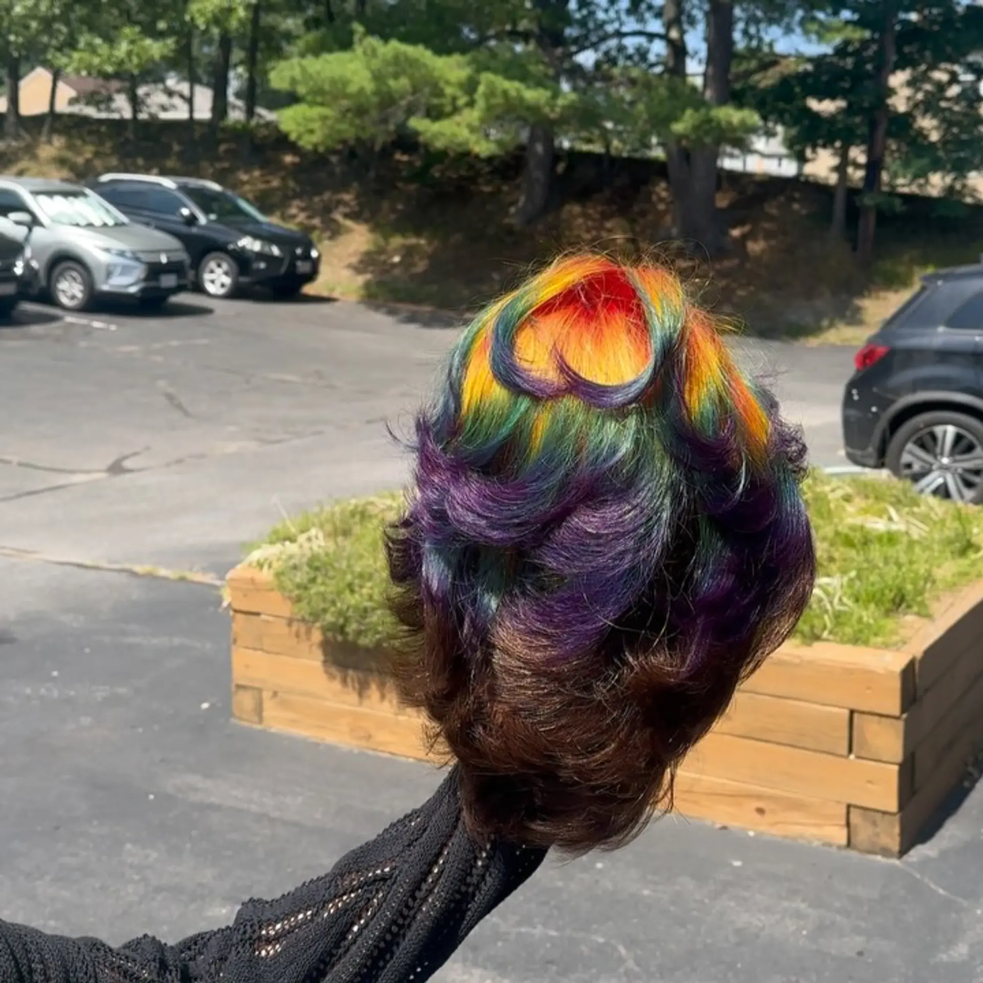Layered short cut featuring an intricate rainbow prism color spectrum blending across feathered layers. 1