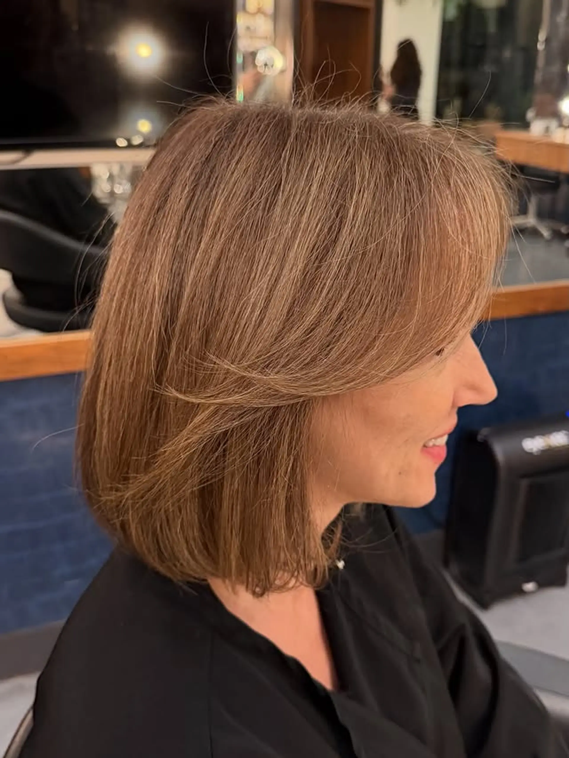 A classic medium bob with face-framing layers and bangs. 1