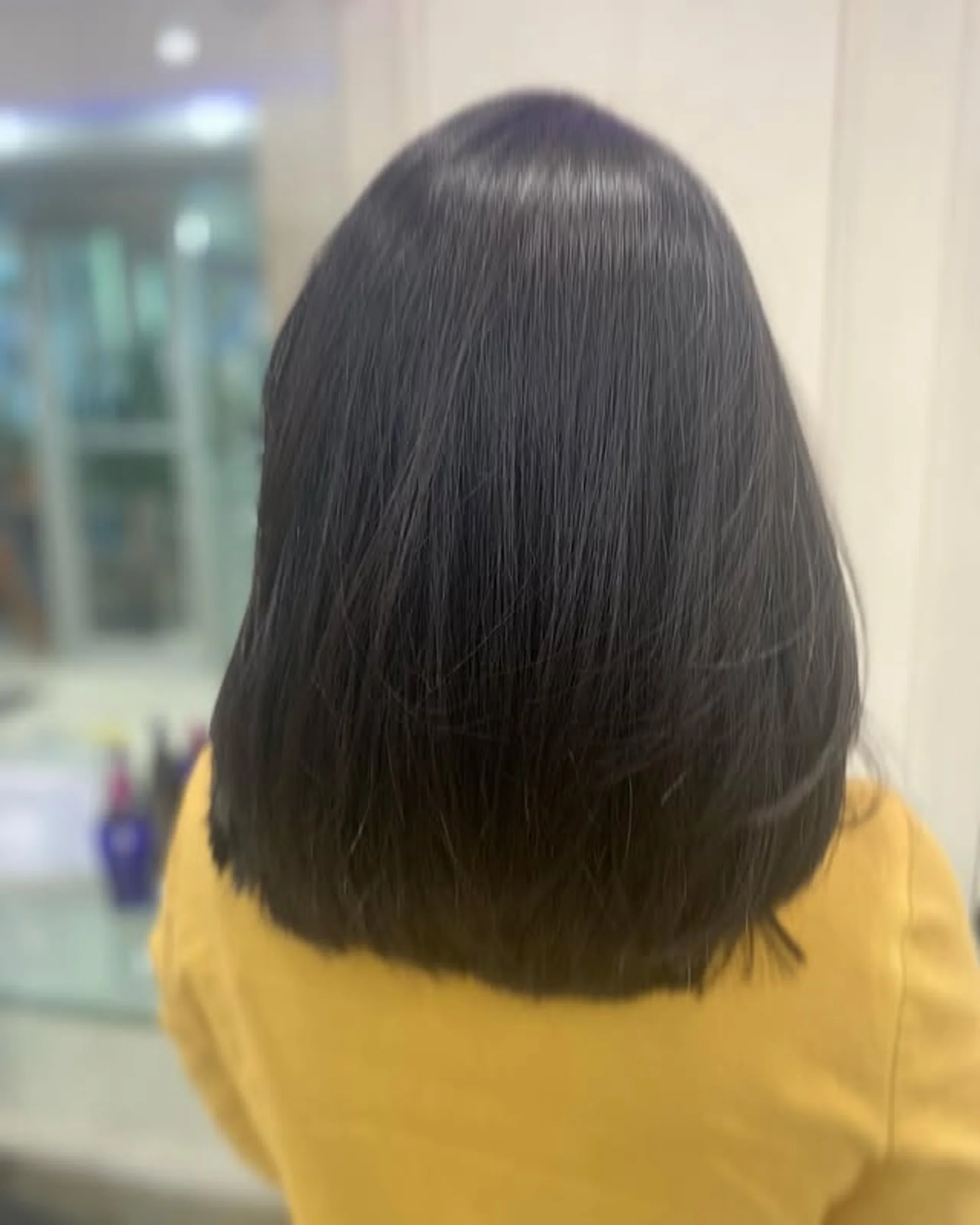 Sleek, straight short bob with sharp, straight bangs, a classic and professional look. - Preview 3