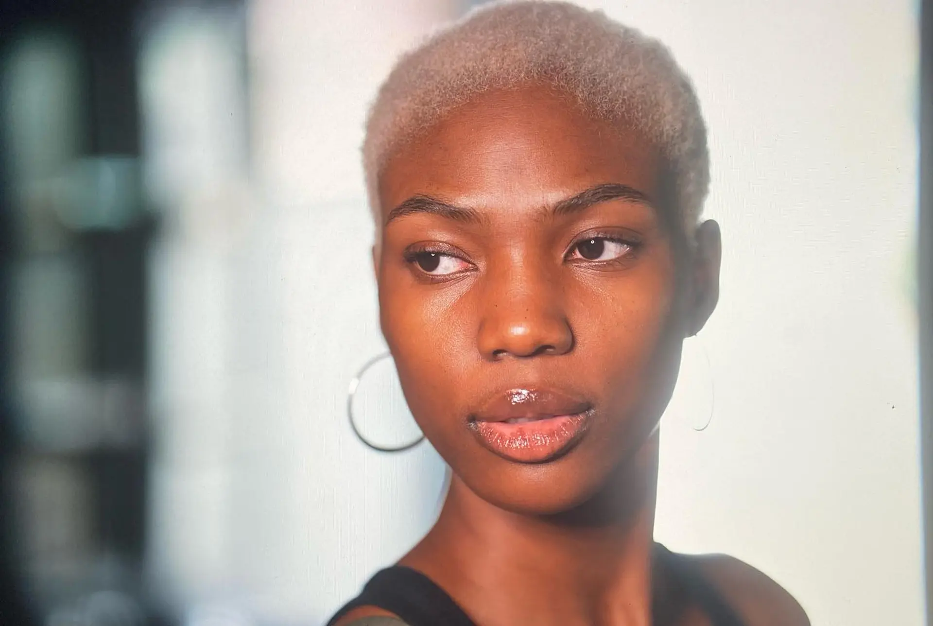 A very short buzz cut dyed in a platinum blonde. 3