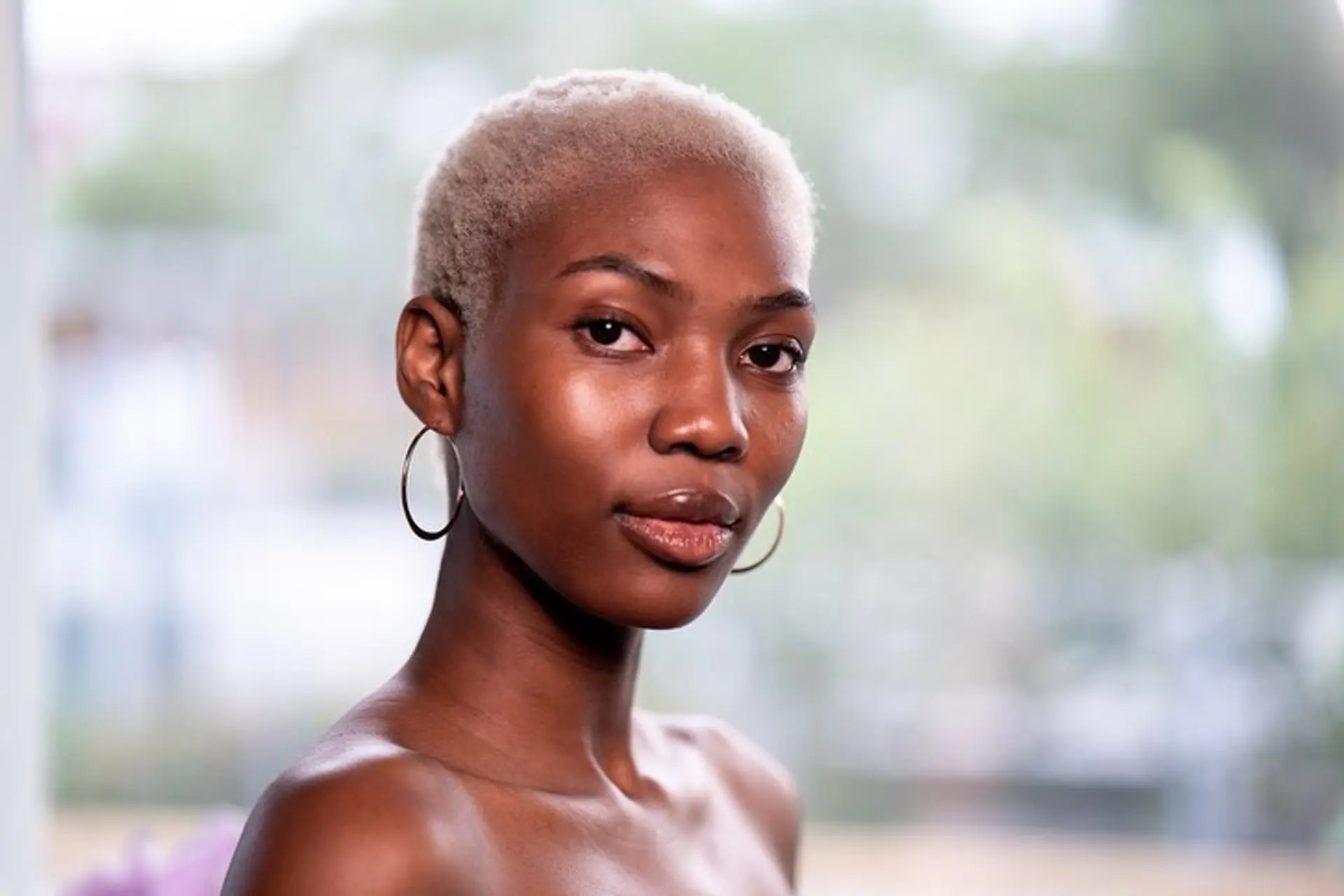 A very short buzz cut dyed in a platinum blonde. 5