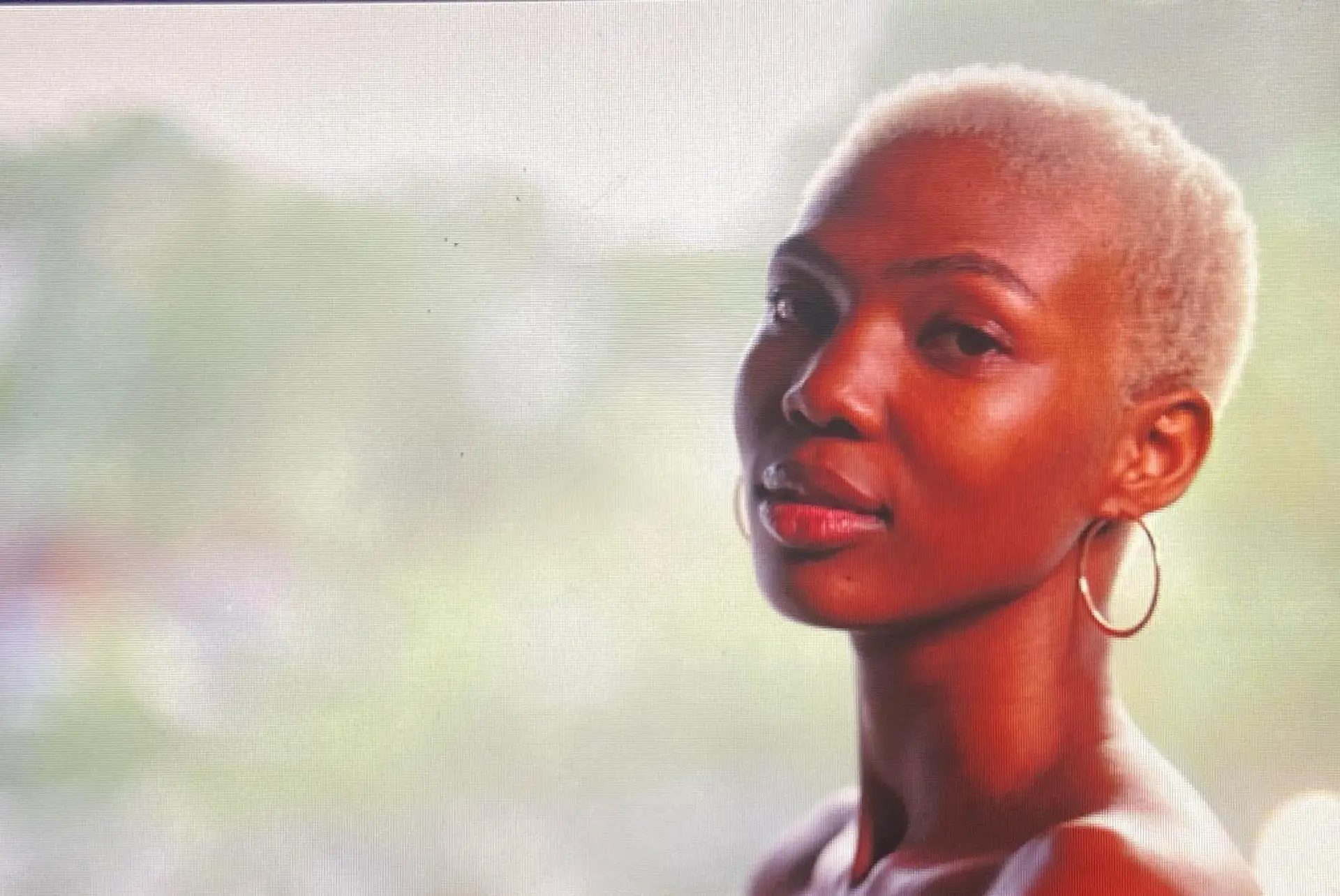 A very short buzz cut dyed in a platinum blonde. 6