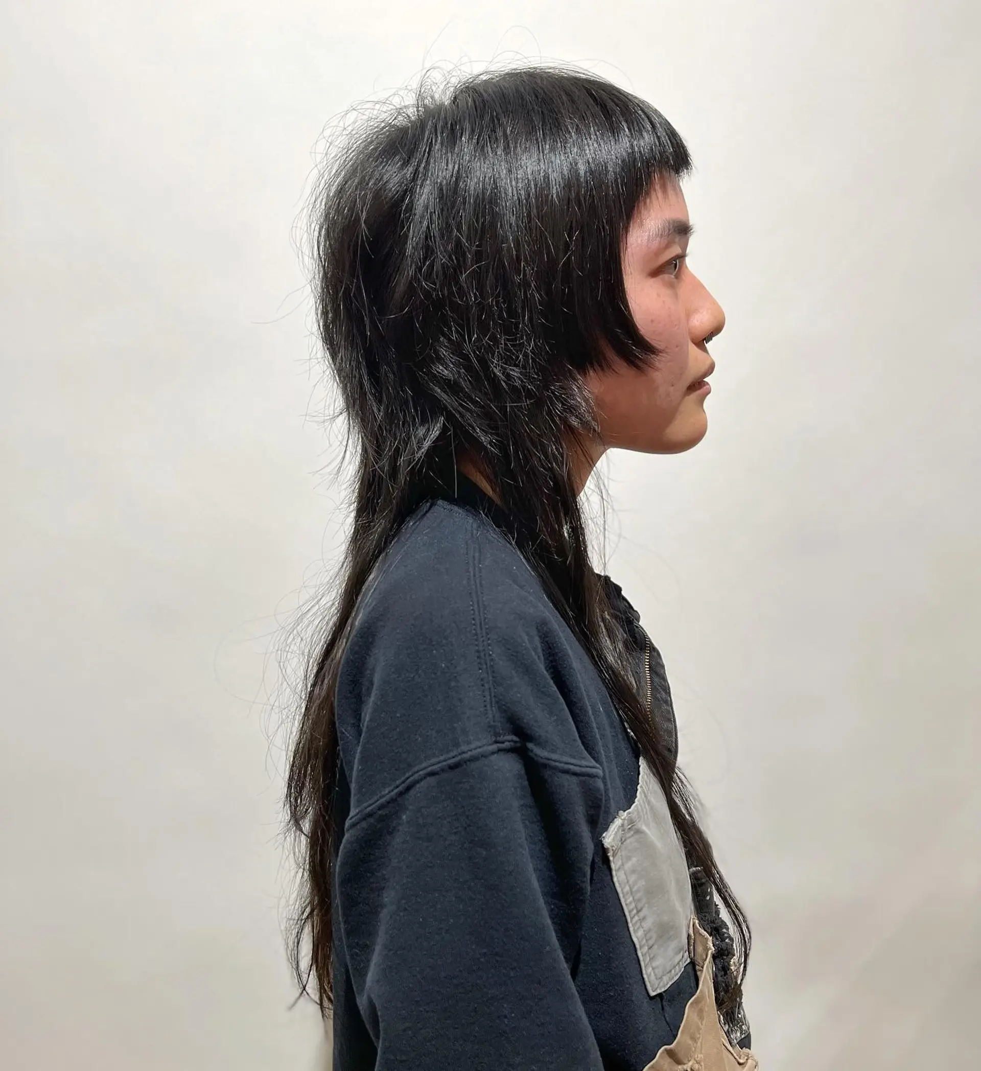 A modern, edgy take on the classic shag with choppy layers and bold, blunt bangs. 1