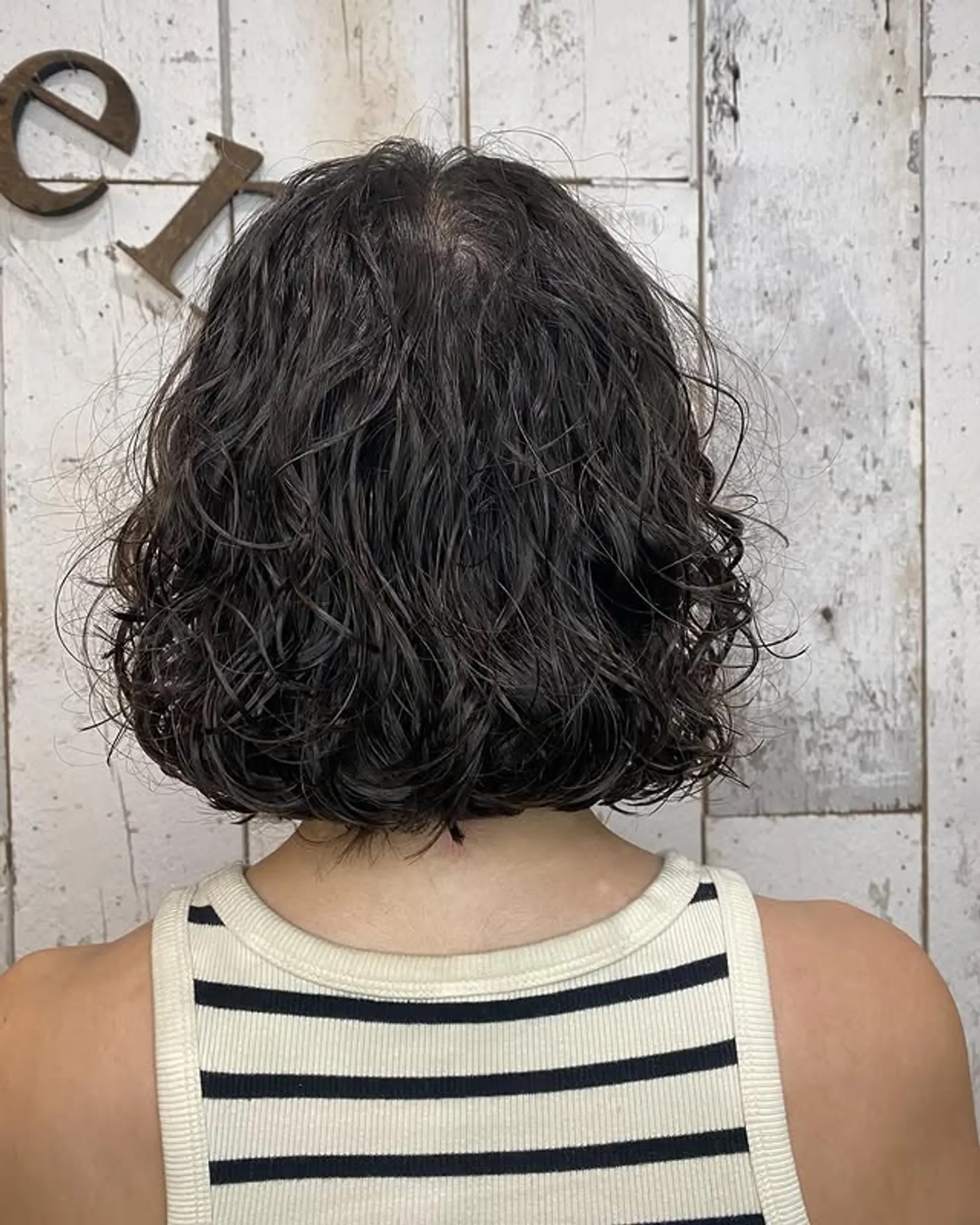 A curly bob with natural curls and added volume. 1