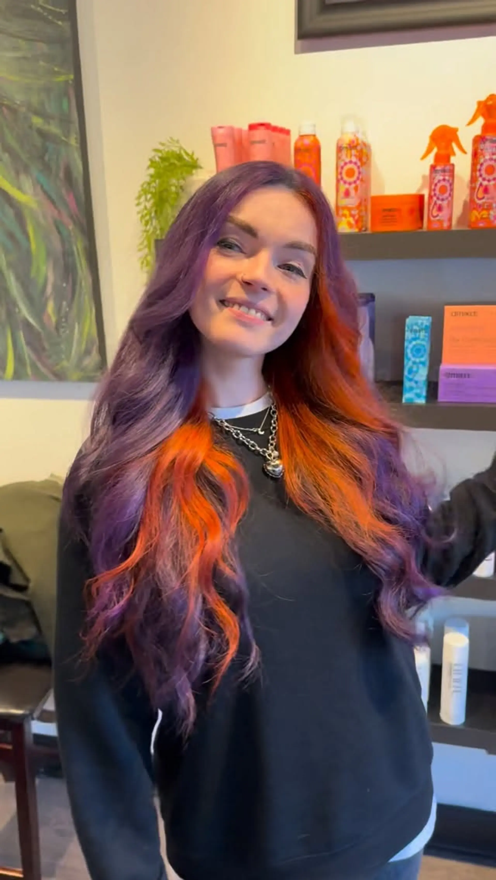 Long wavy hair dyed in a rich purple hue featuring bold, contrasting orange color-block accents around the face and interior. 1