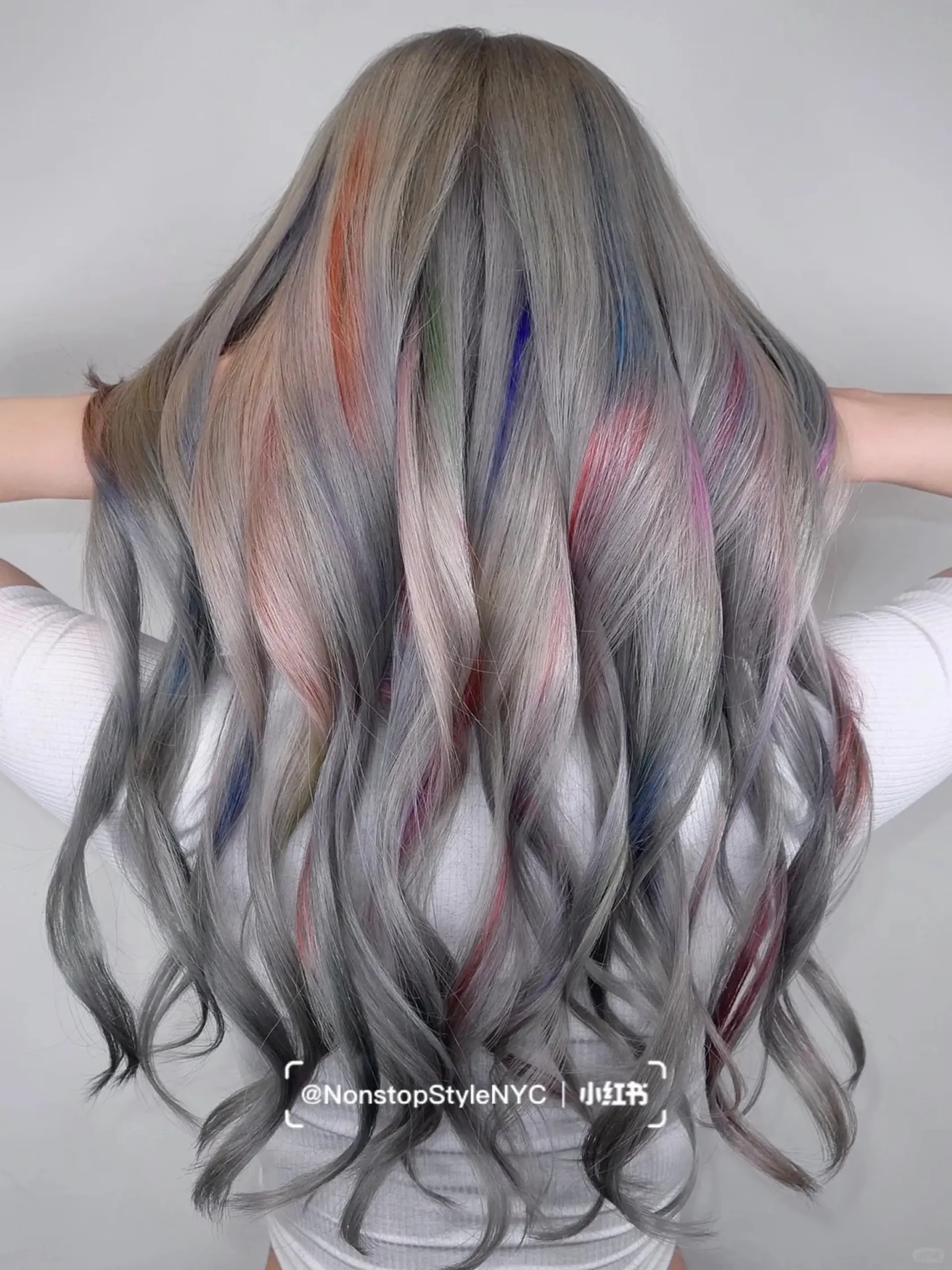 Very long, wavy hair in a silver base color with vibrant streaks of pink, blue, green, and purple, creating an iridescent, holographic effect.

(NonstopStyle: by Kelvin) 1
