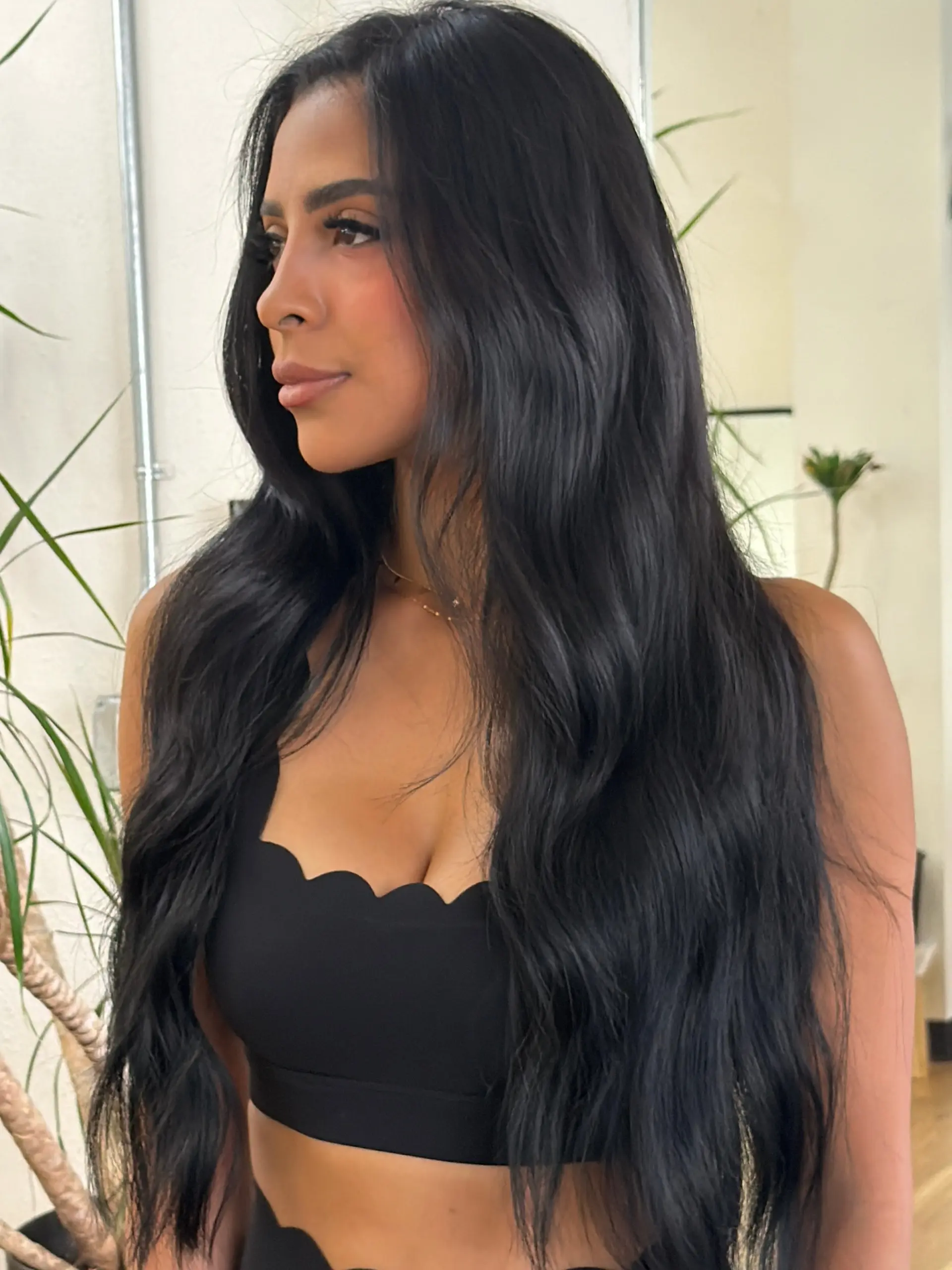 Extra-long, glossy jet-black hair styled with smooth, cascading loose waves falling past the chest. 1