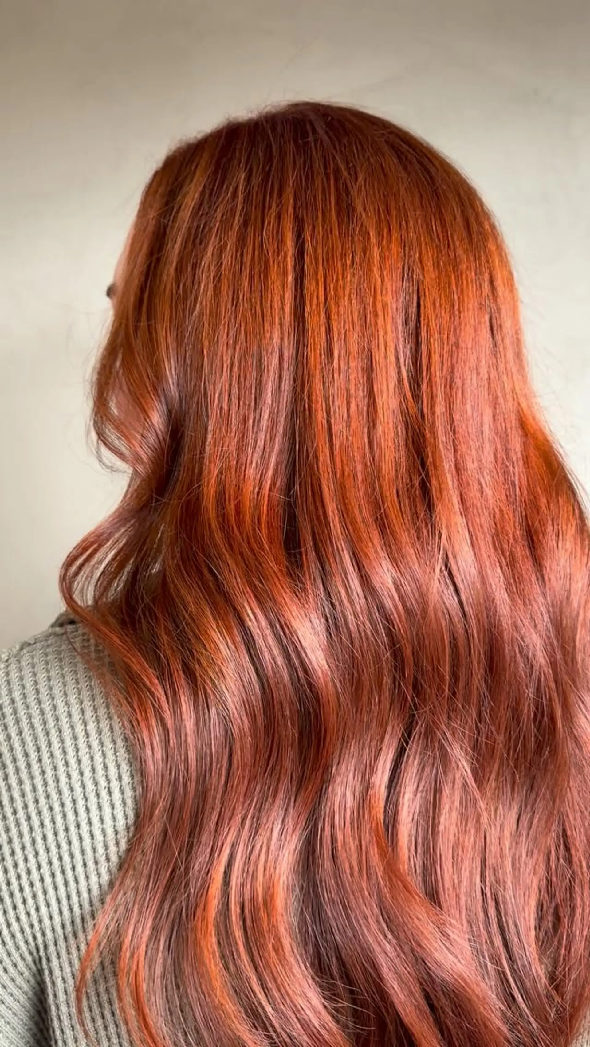 Long, flowing warm cinnamon copper hair styled in soft, textured waves. 1