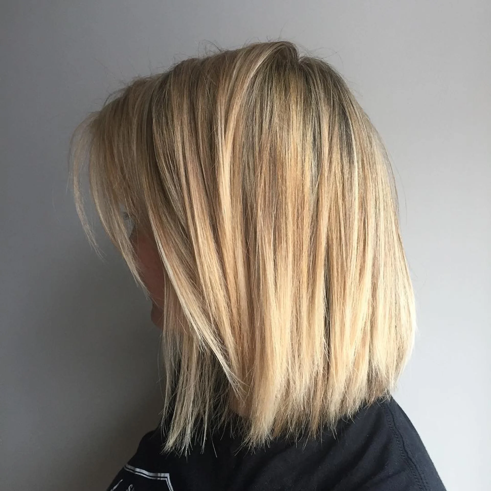 A sleek, medium-length blunt lob cut at the collarbone featuring caramel balayage. - Preview 1