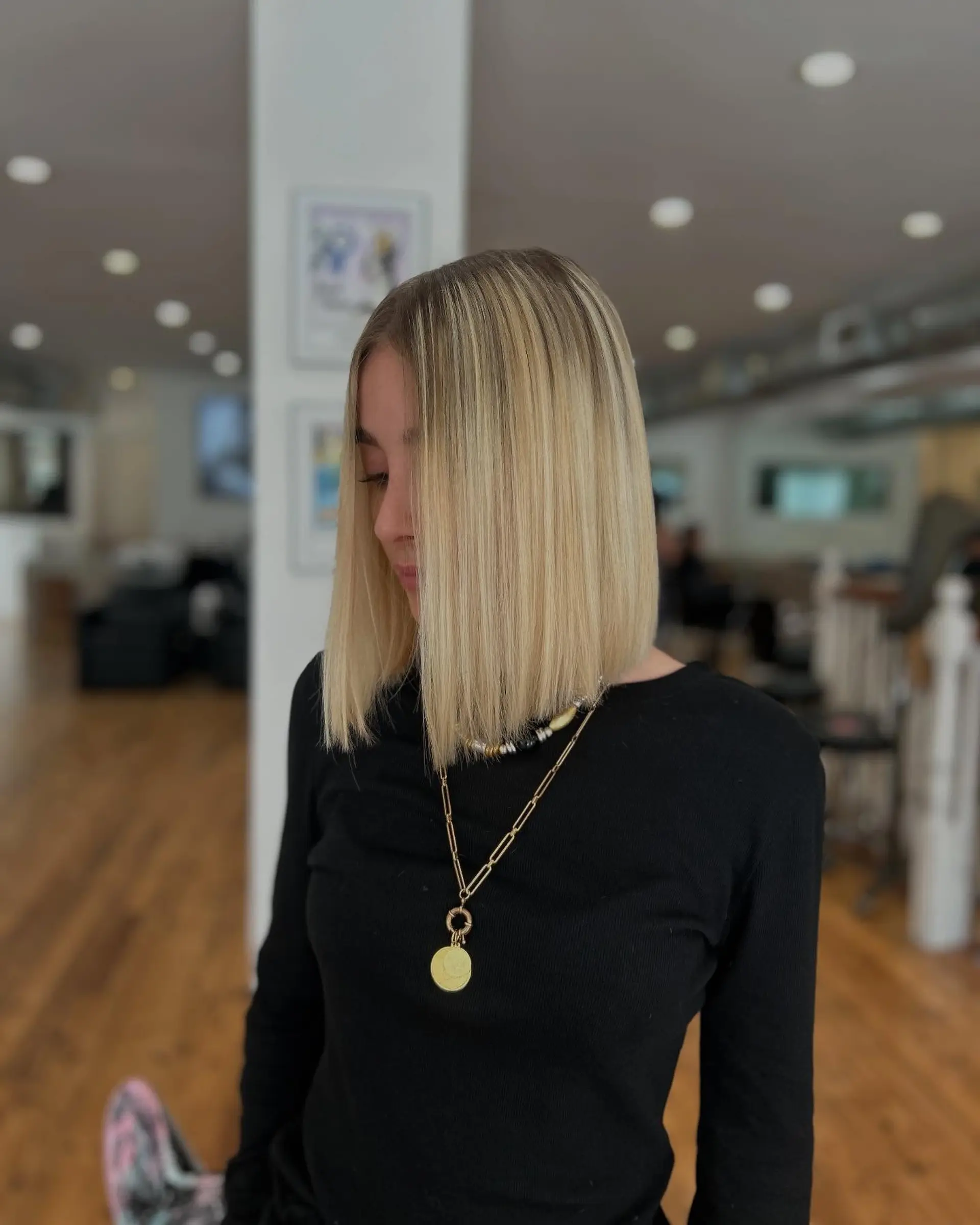 A sleek, straight blunt bob with shadow roots. 2