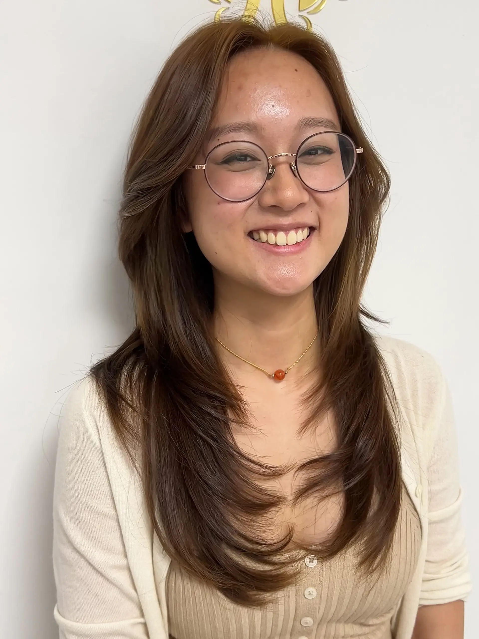 A long, layered haircut with distinct face-framing layers for added dimension. 1