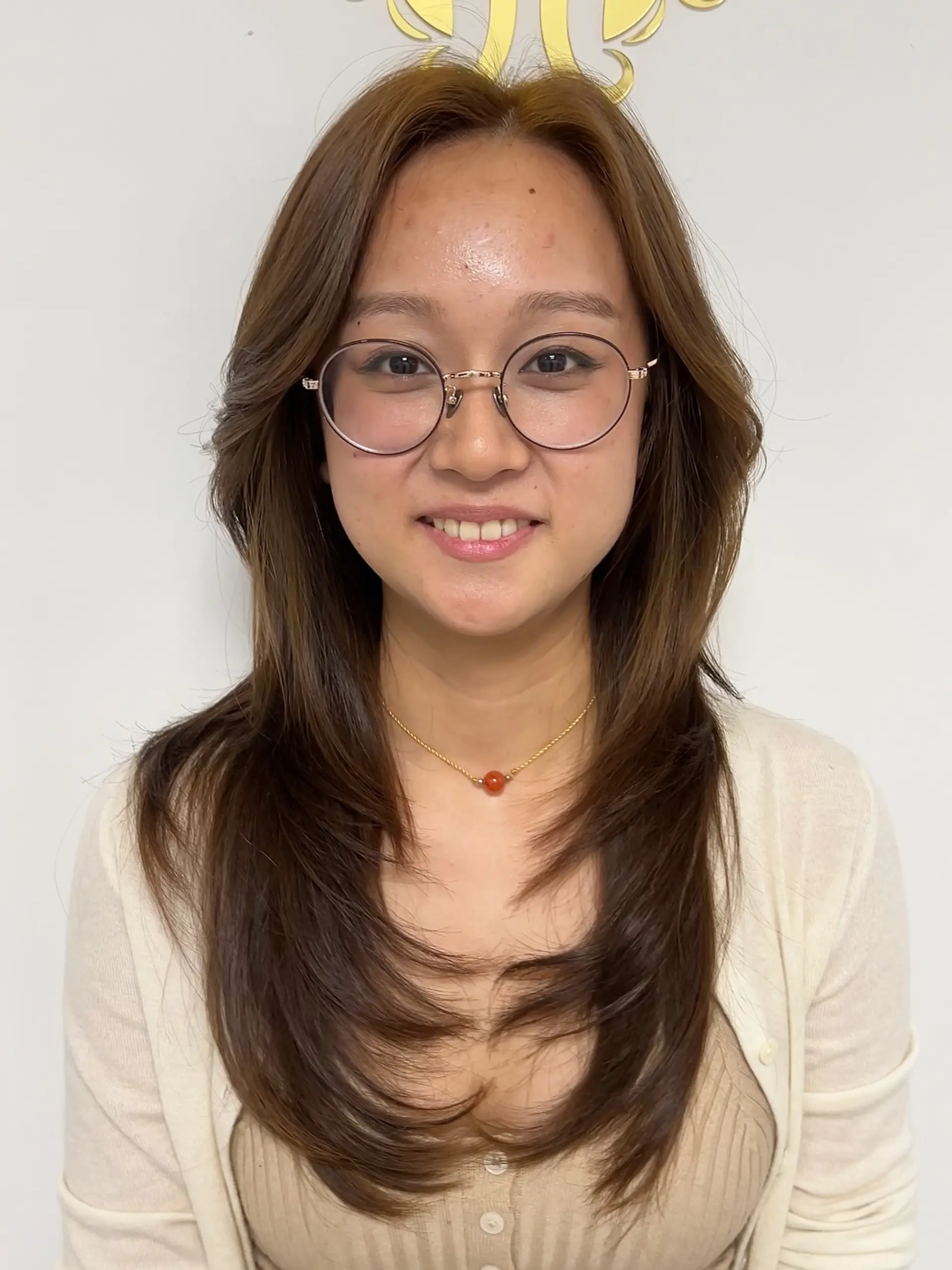 A long, layered haircut with distinct face-framing layers for added dimension. 2