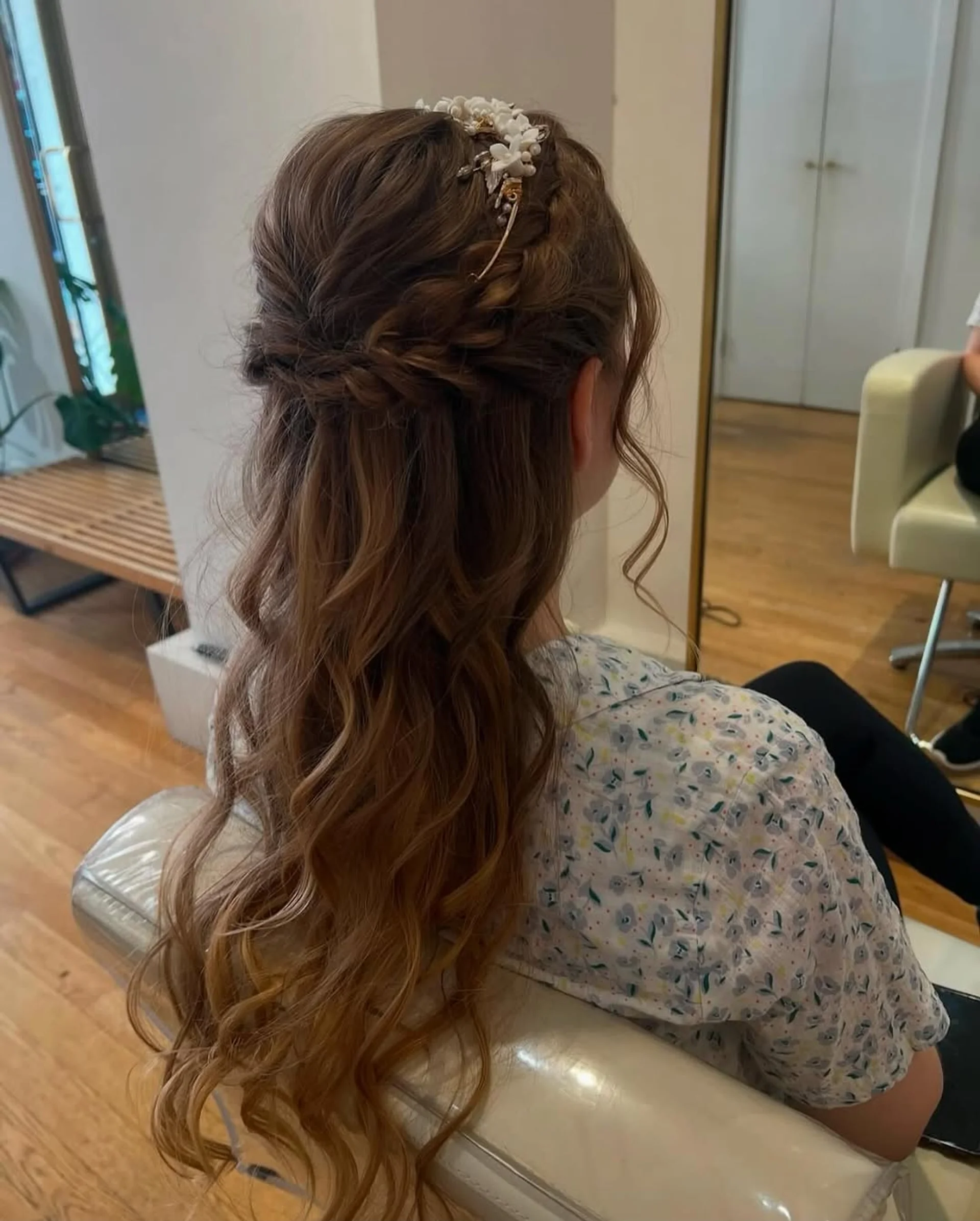 A woman with long, romantic brown waves and face-framing highlights, a key date night hair trend for 2025. - Preview 3