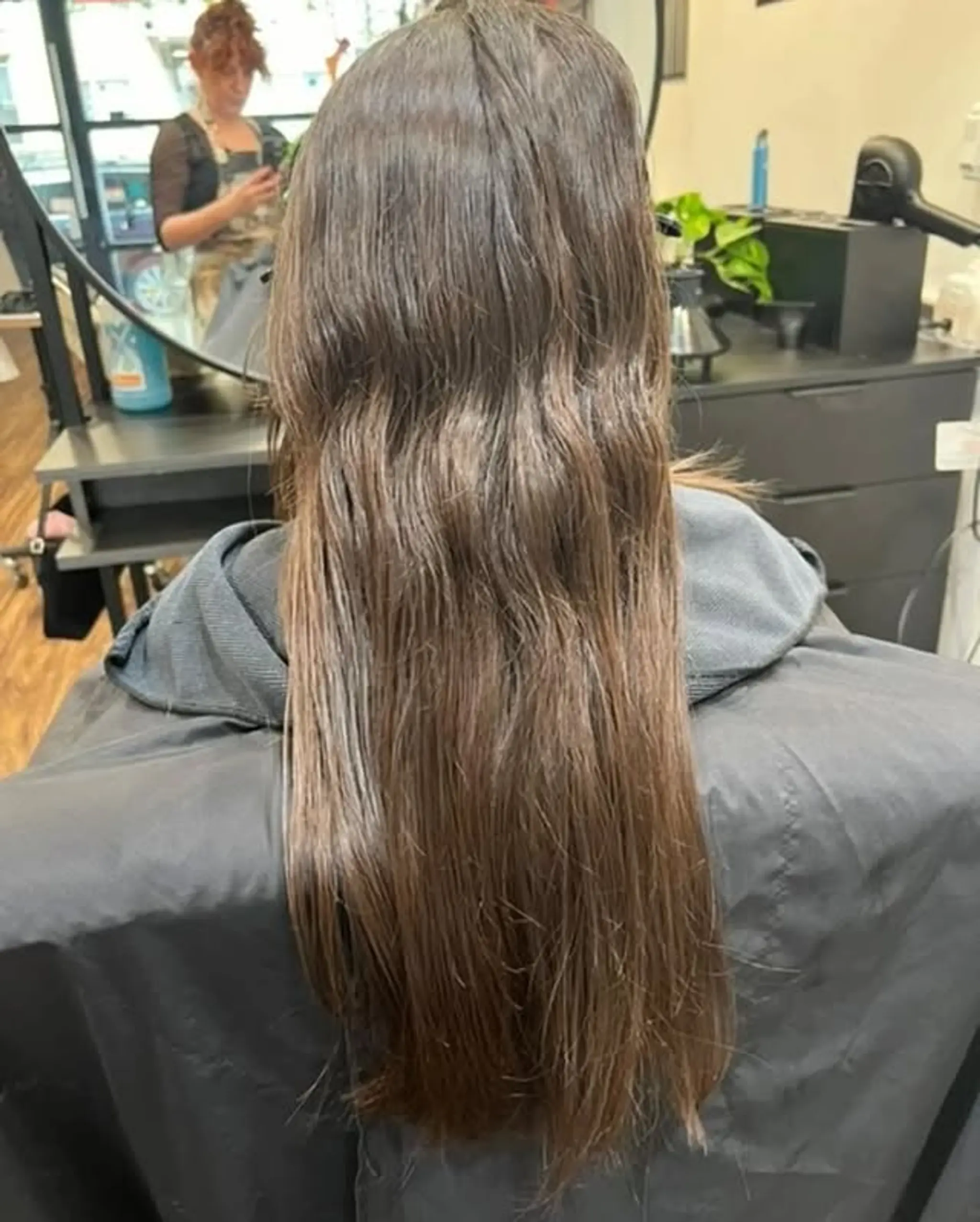 Long layered haircut to frame the face.