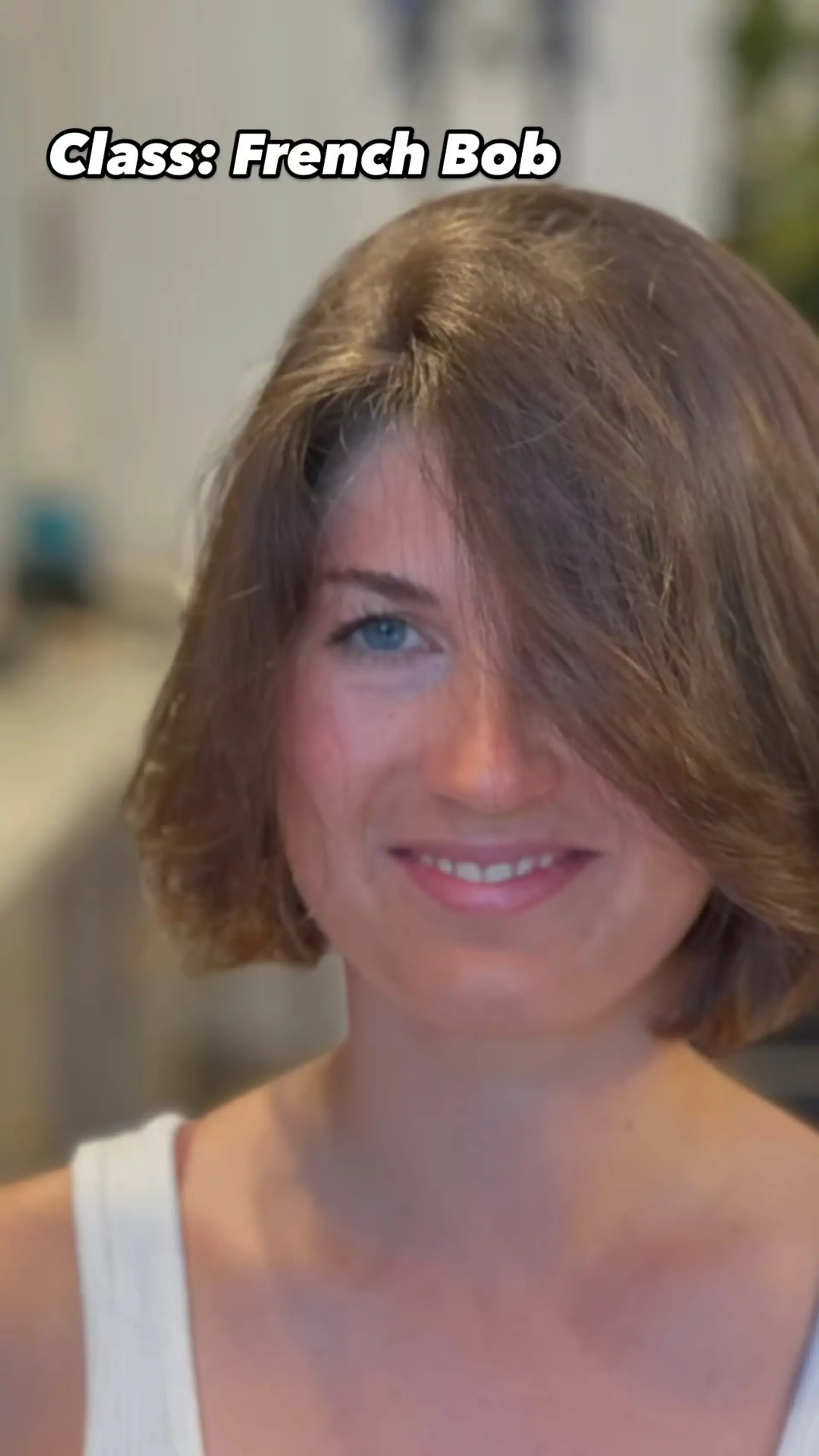 A textured chin-length French bob styled with natural volume and a soft, side-swept fringe framing the face. 1