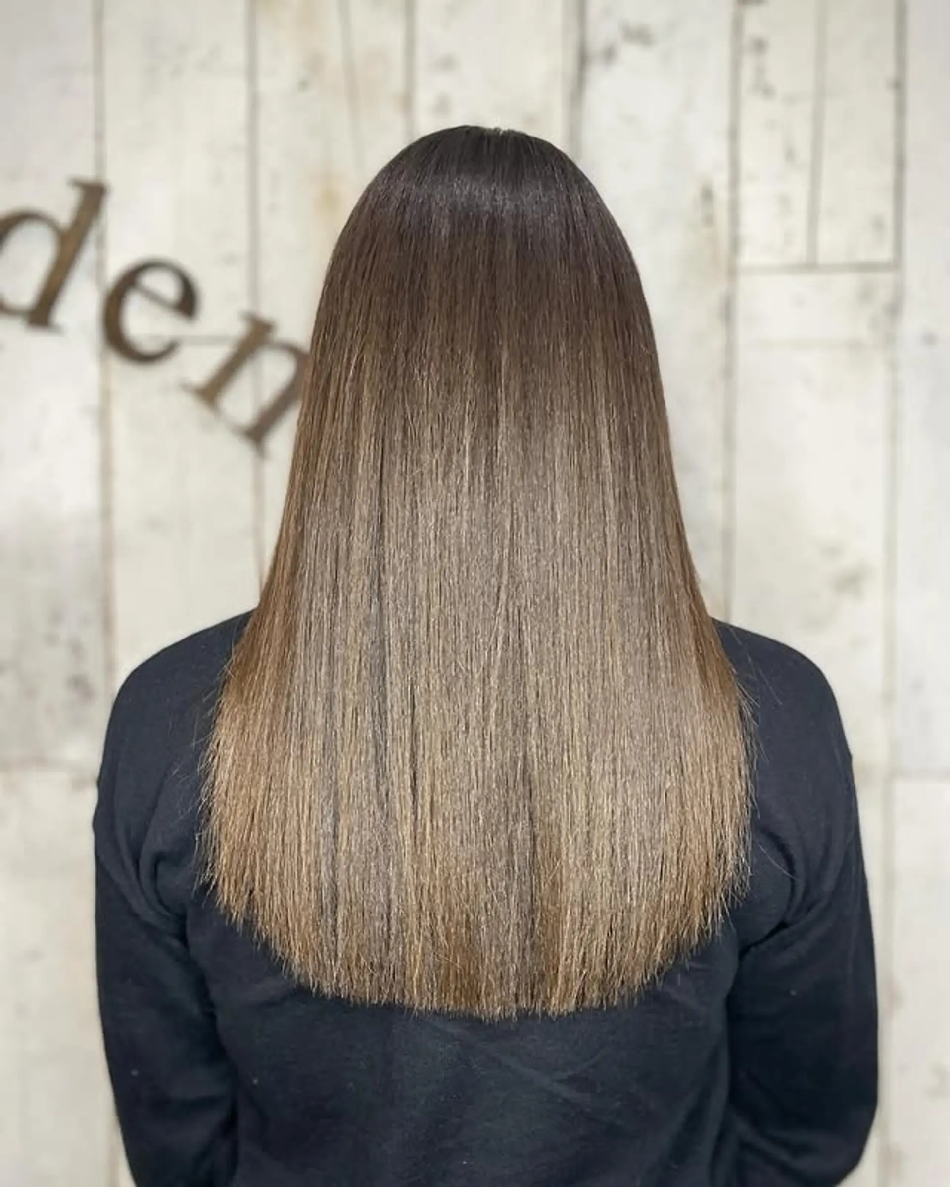 Long, straight hair with a subtle balayage color melt. 1