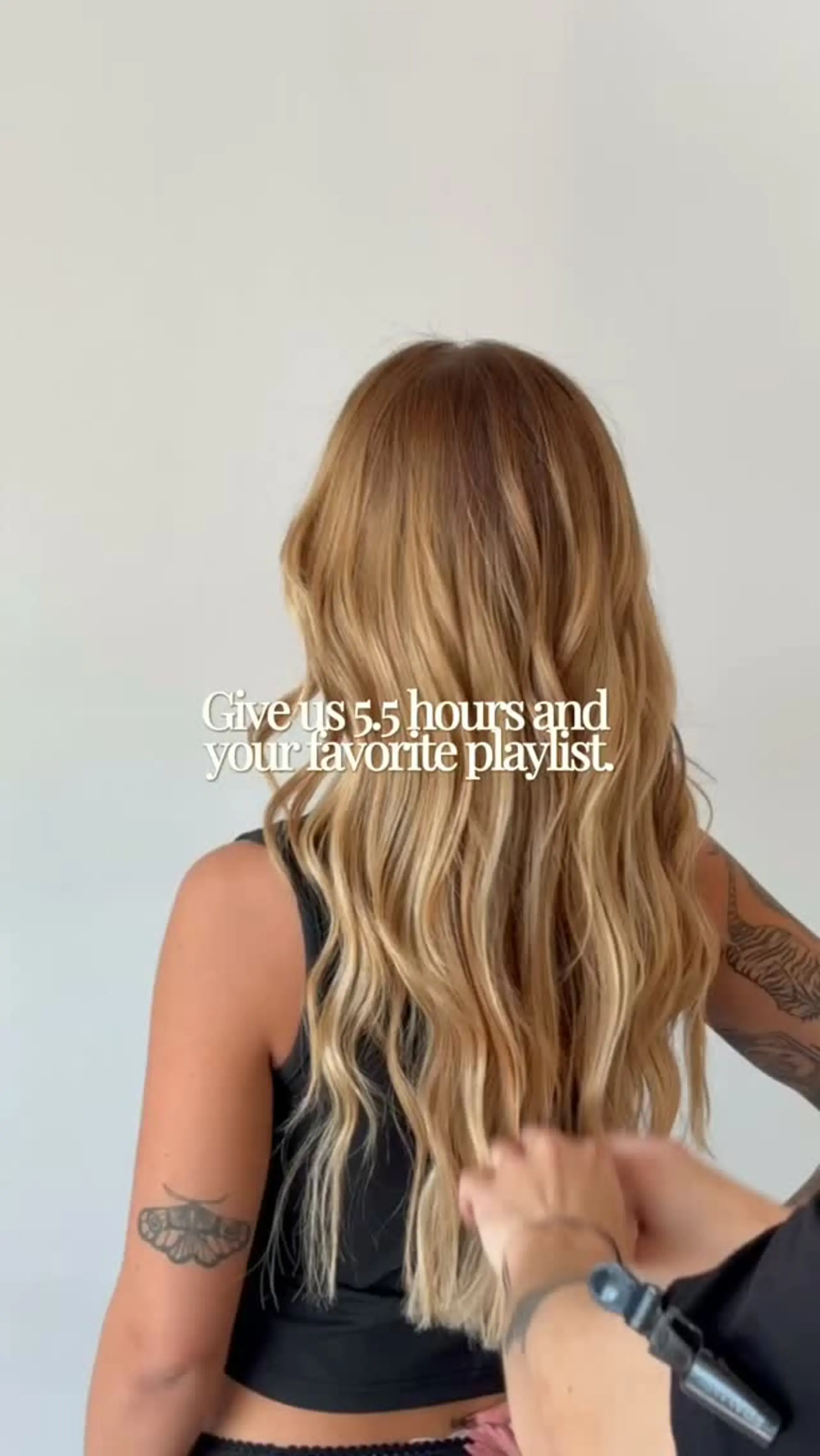 Long golden blonde hair featuring seamless dimensional highlights and styled with loose, flowing waves. 1