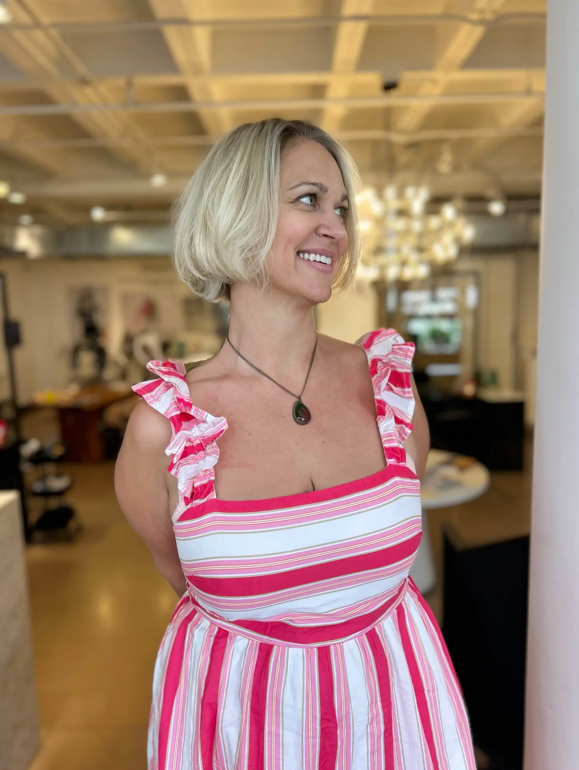 A bright blonde chin-length bob haircut with soft, face-framing curved ends. 1