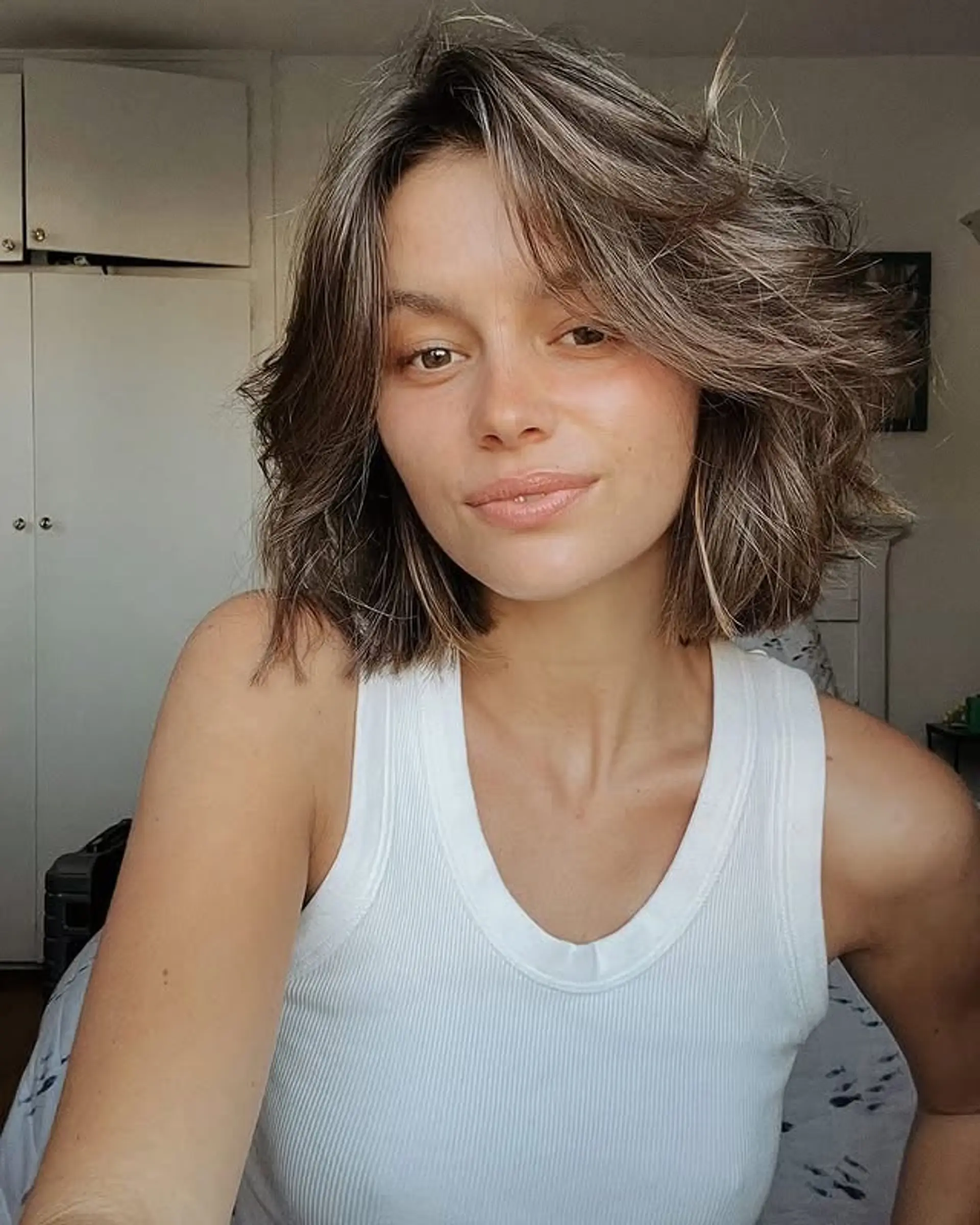 A shaggy, layered bob with face-framing highlights. 1