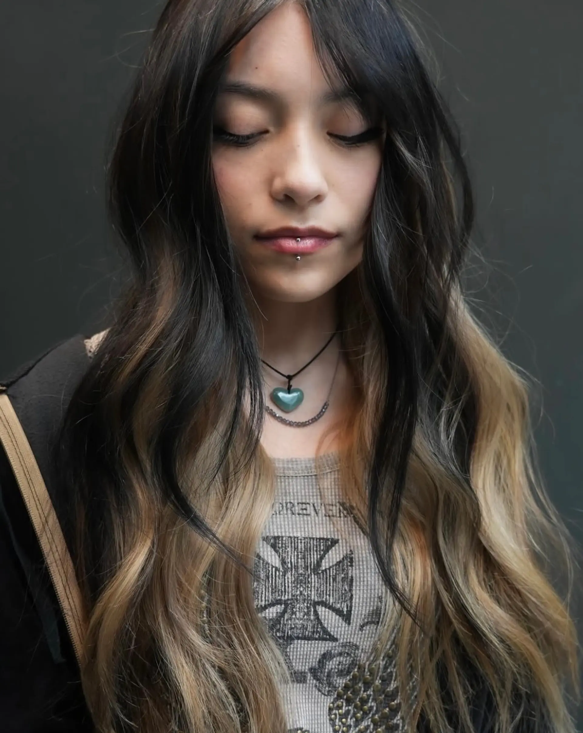 Long cascading waves featuring dynamic color blocking with a dark natural base overlaid atop golden-blonde under-layers. 1