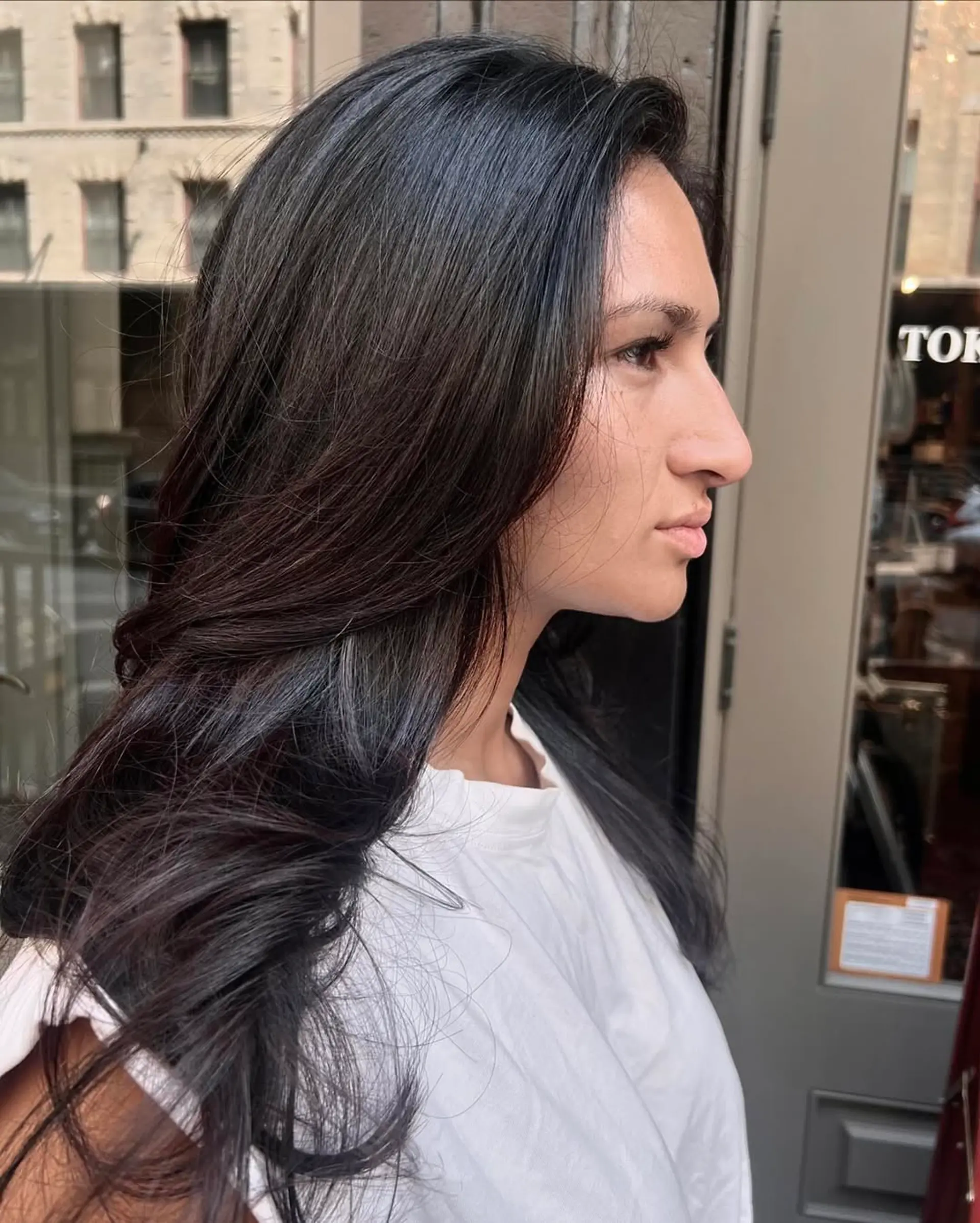 Long wavy hair with sleek layers and a side part, showcasing natural shine. 1