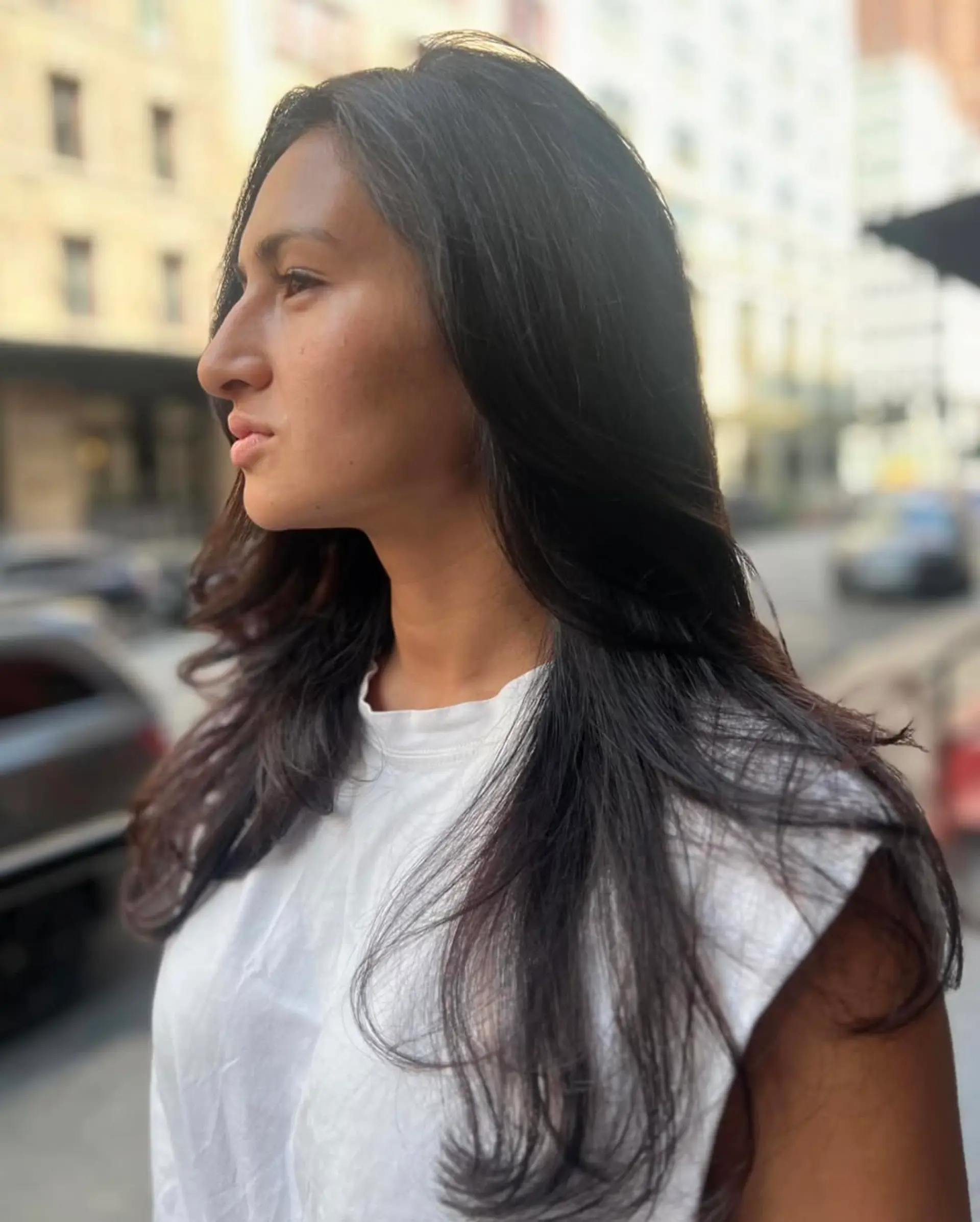 Long wavy hair with sleek layers and a side part, showcasing natural shine. 3