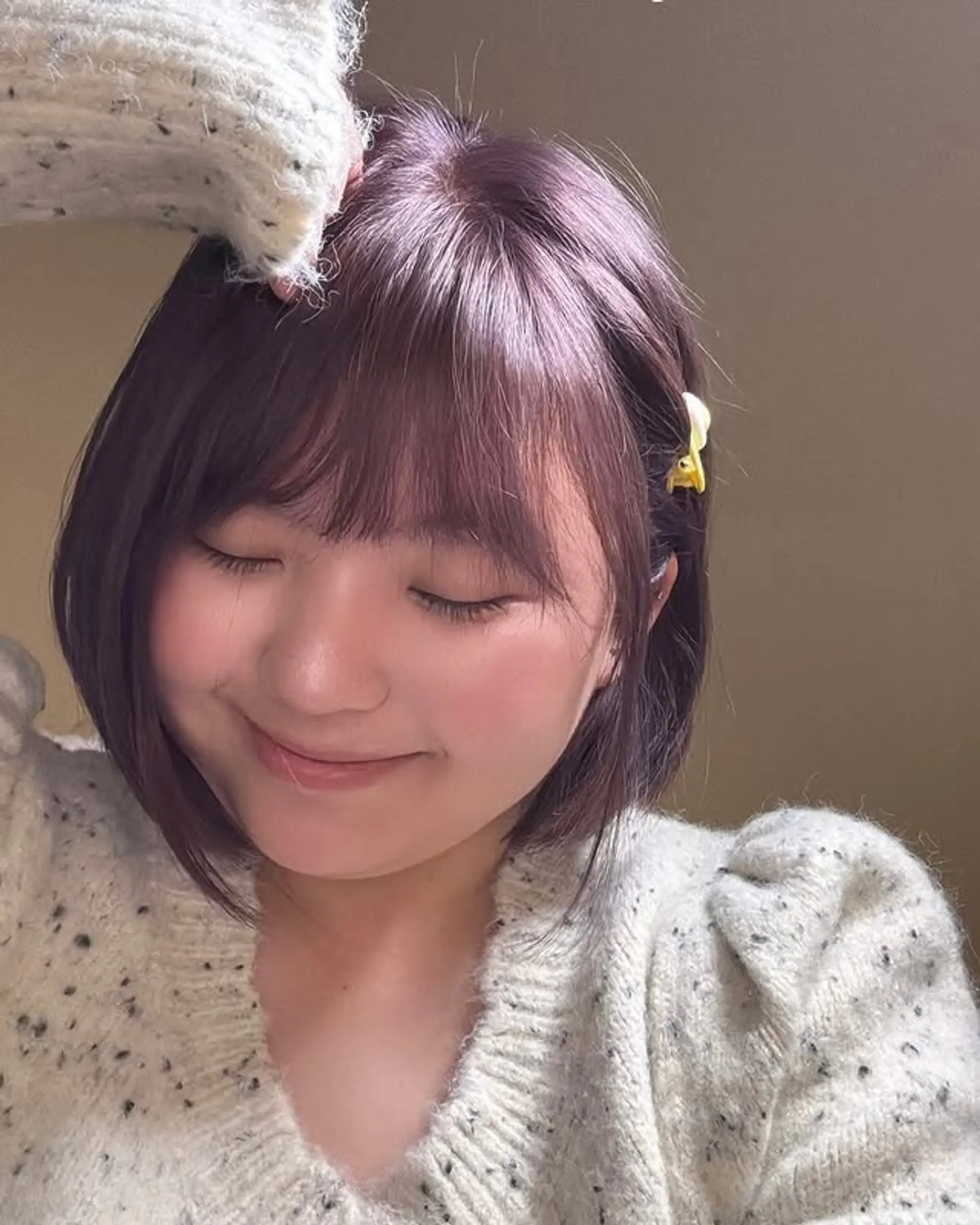 A modern purple tinted bob with blunt bangs. 1