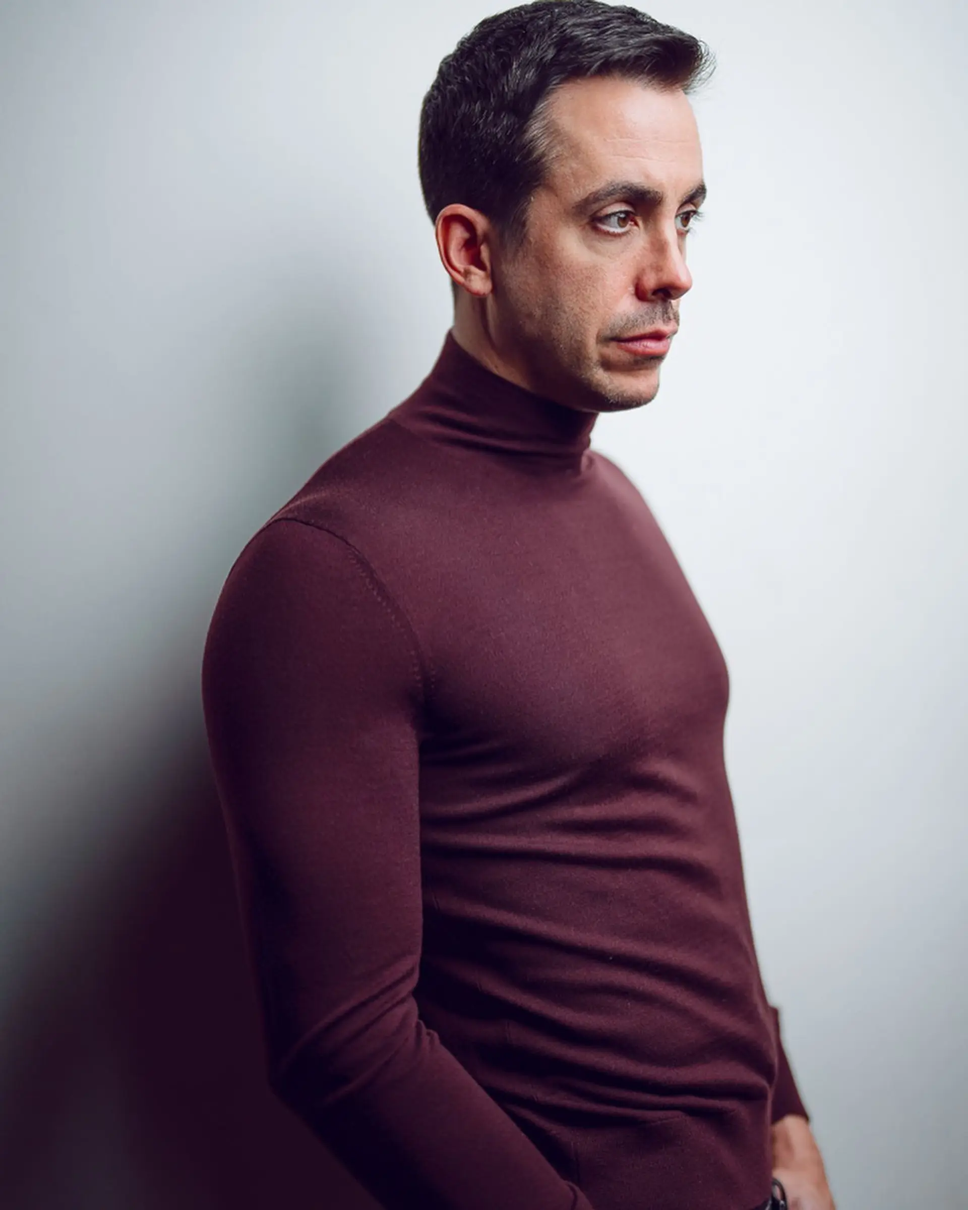 A classic men's short haircut with tapered sides and textured styling on top. 1