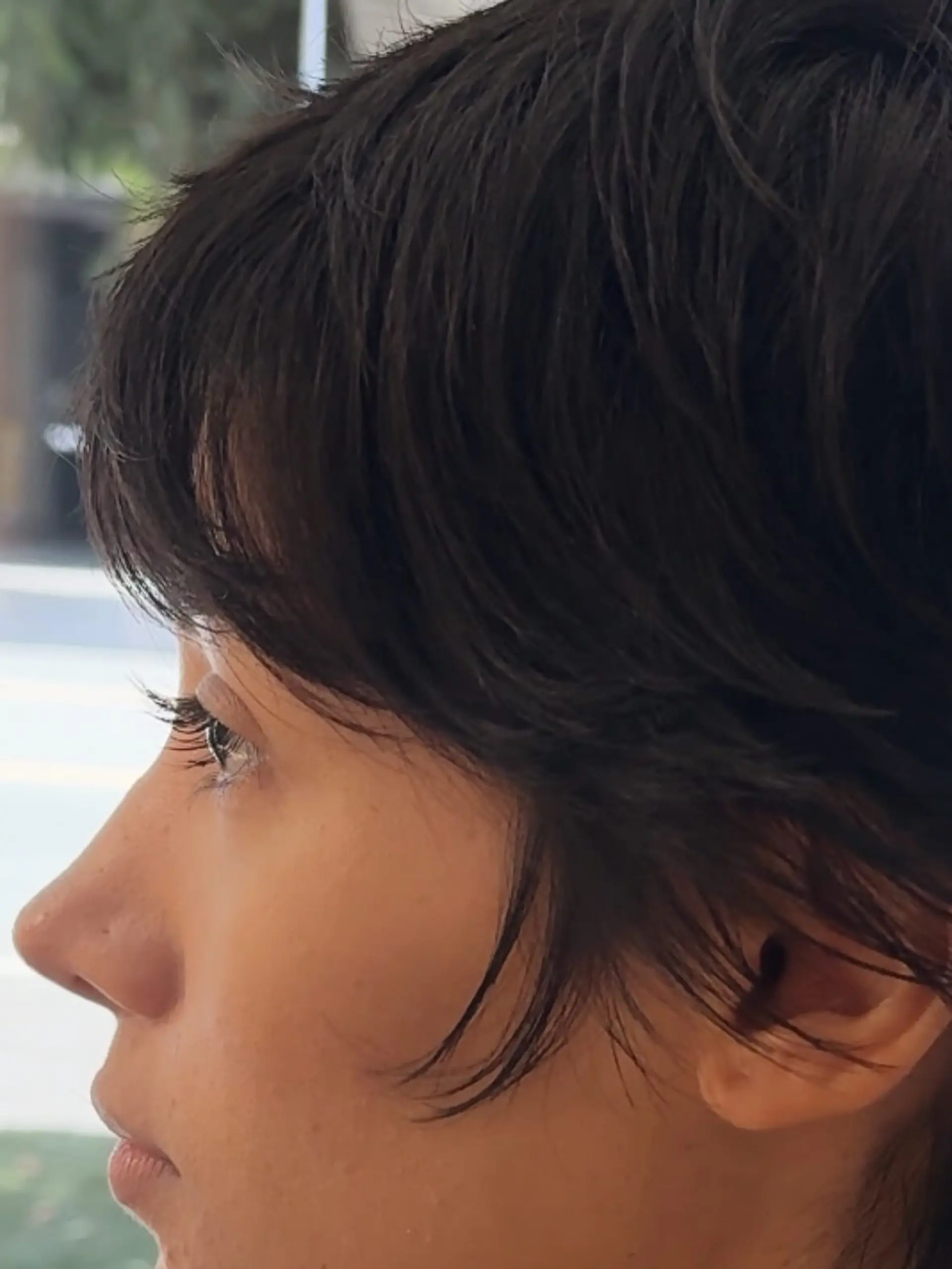 A soft, textured pixie cut featuring delicate face-framing pieces and wispy layers. 1