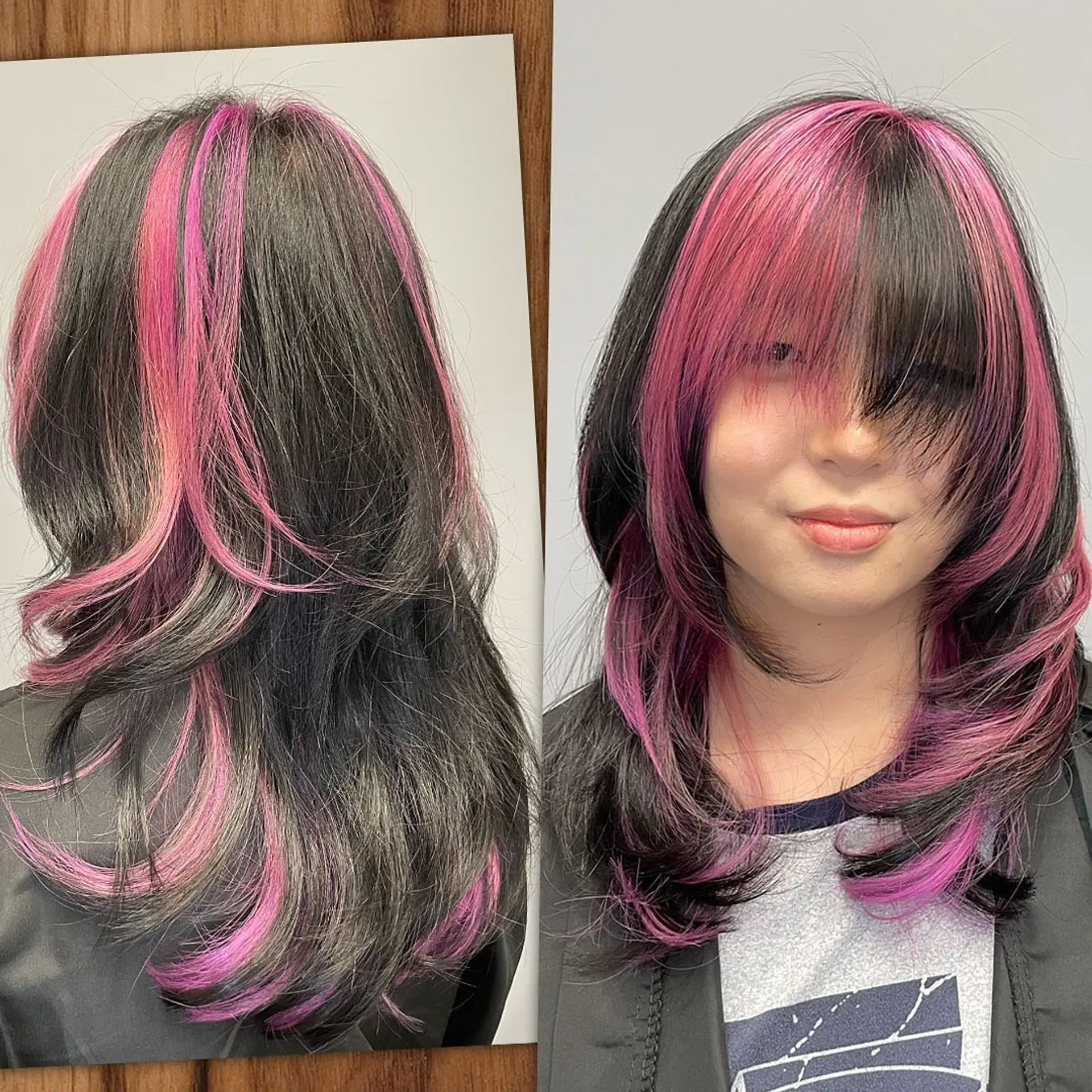 Medium-length layered cut with face-framing fringe and bold magenta-pink streak highlights. 1