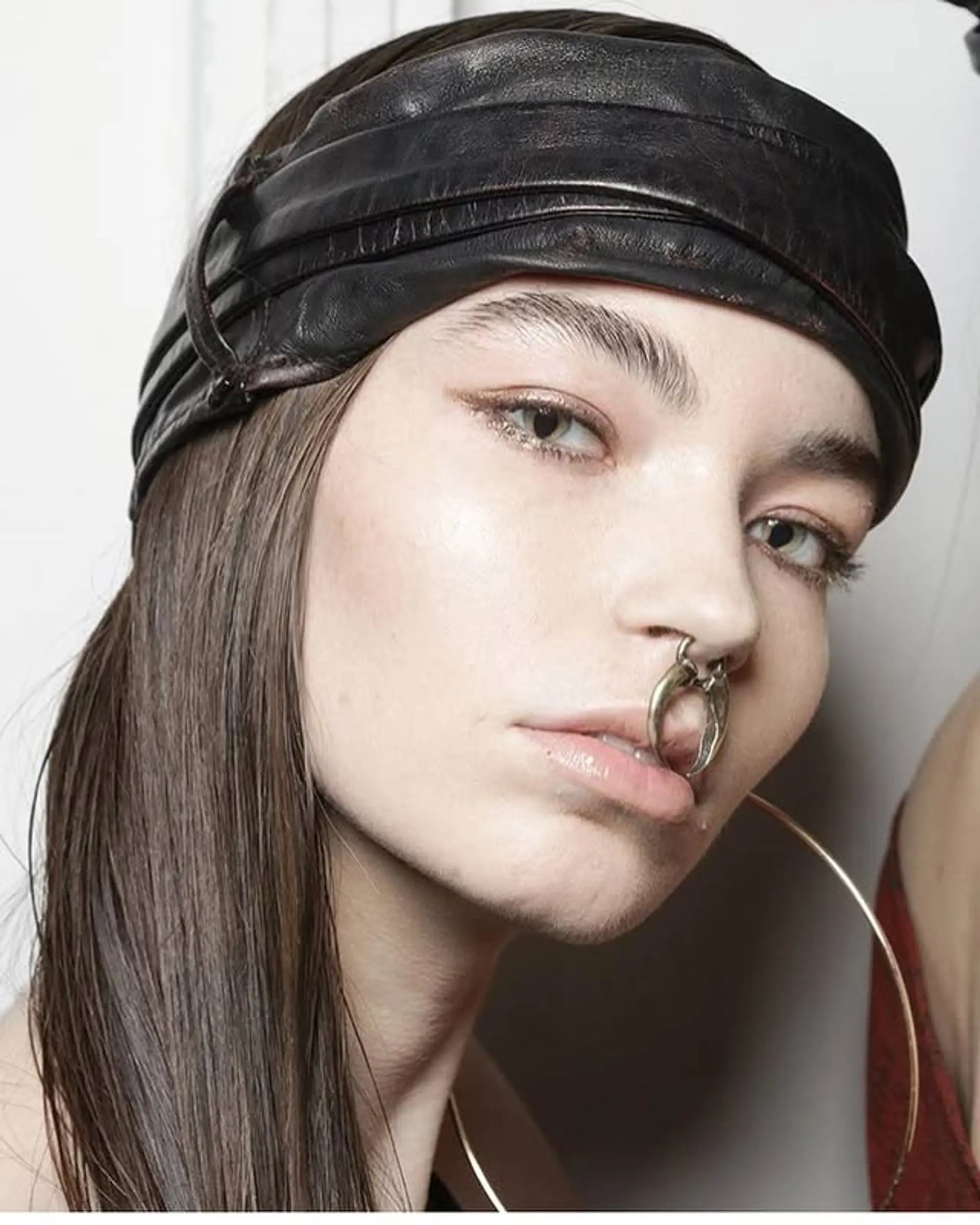 Long, straight hair styled with a headband. 1