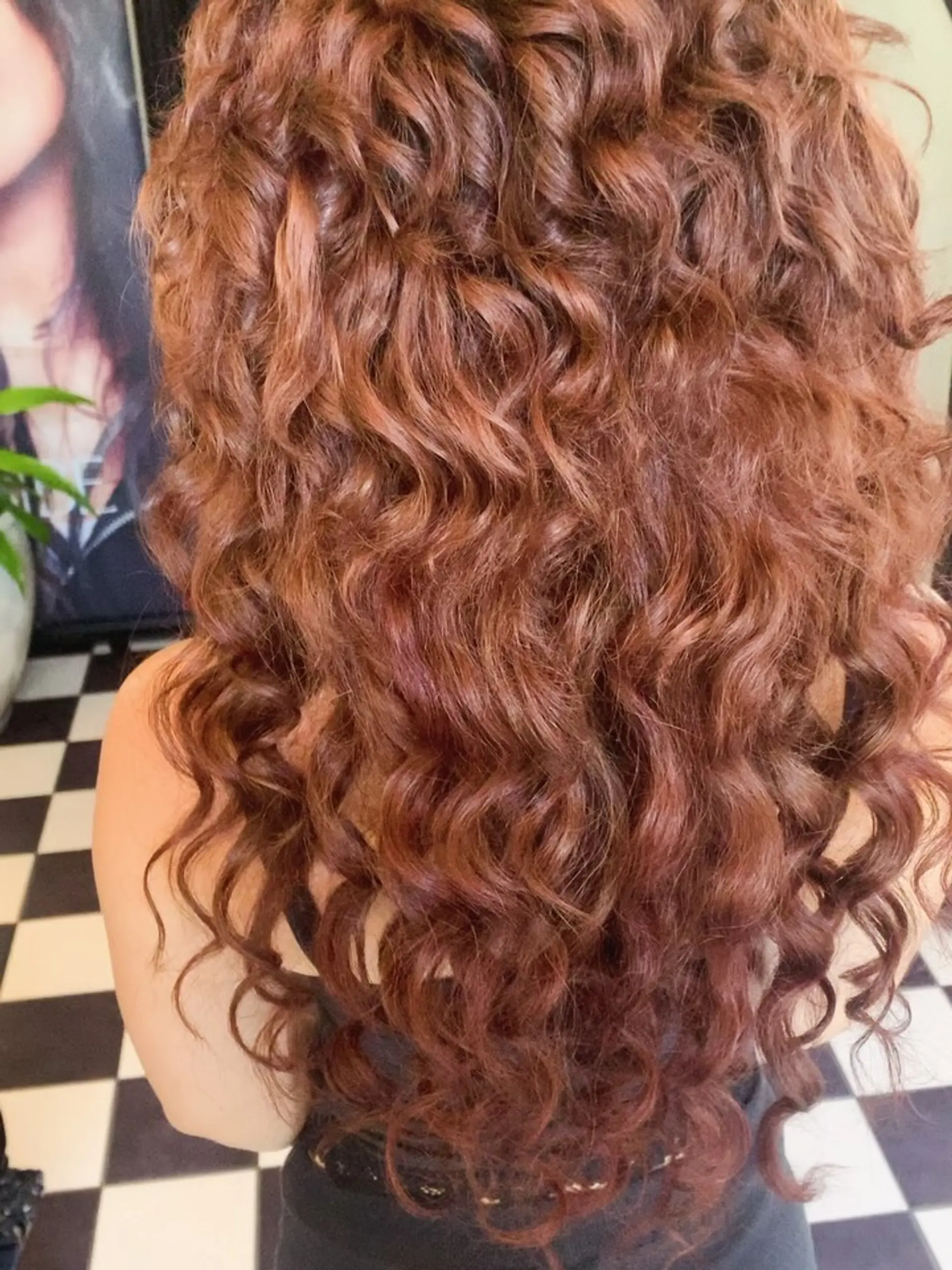 Voluminous, long cascading curls with rich auburn and warm copper tones. 1