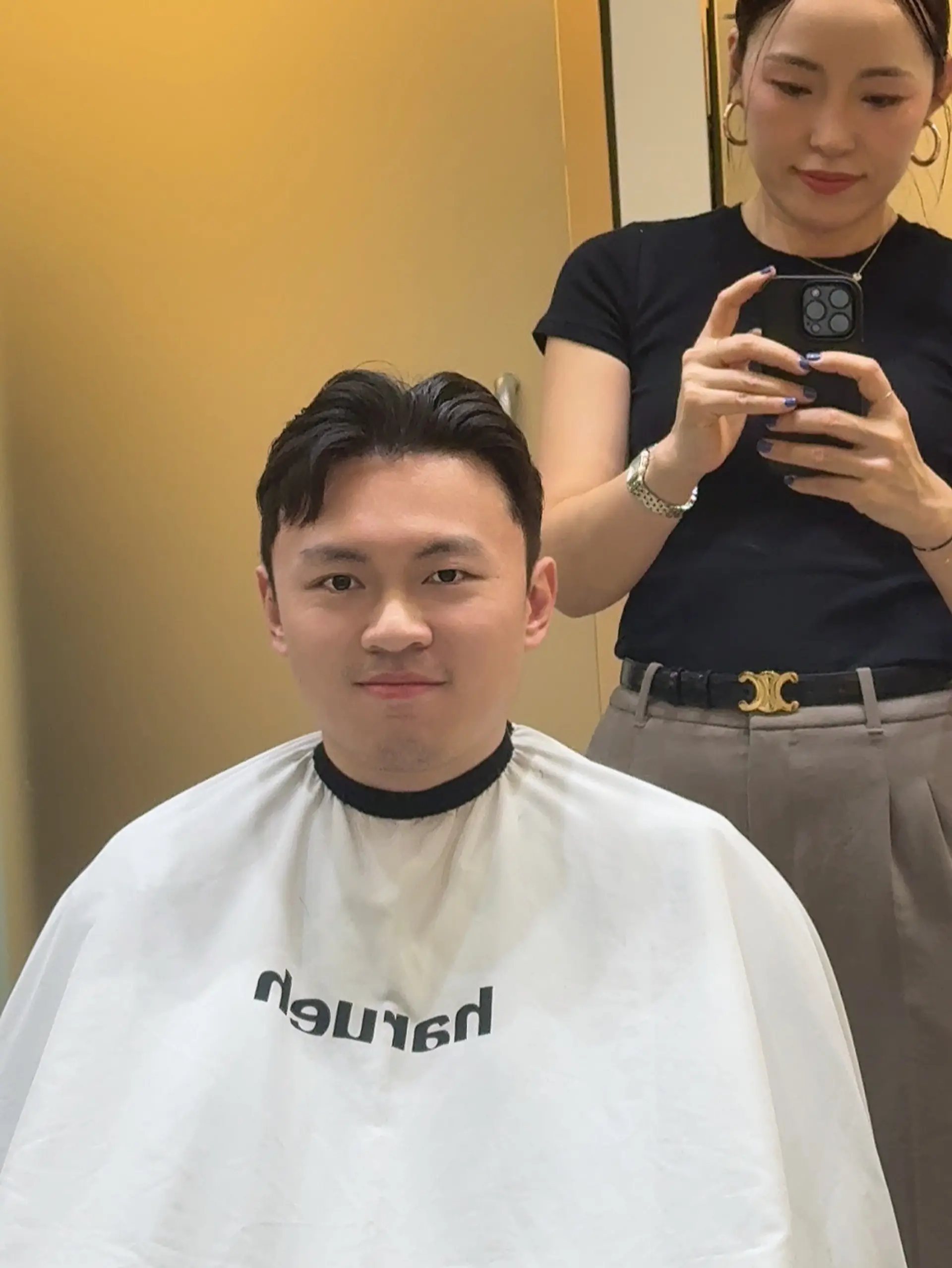 A versatile two-block cut with tapered sides and a soft center-parted, textured top for a clean and modern silhouette. 1