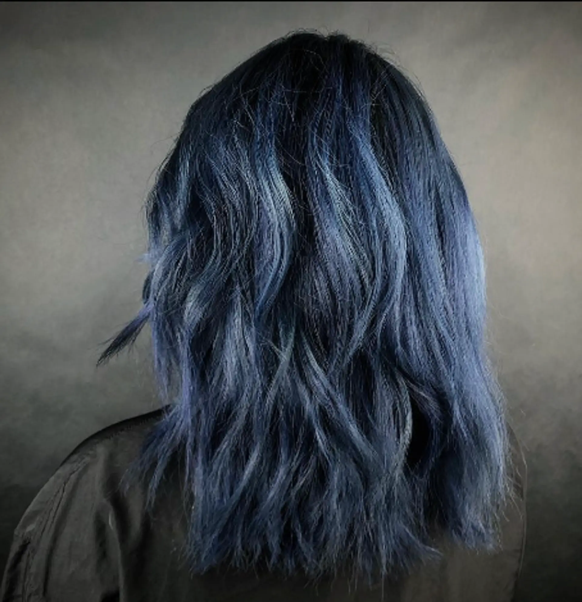 This medium-length hairstyle features a striking dark blue to light blue gradient with wavy texture and luminous shine. 1