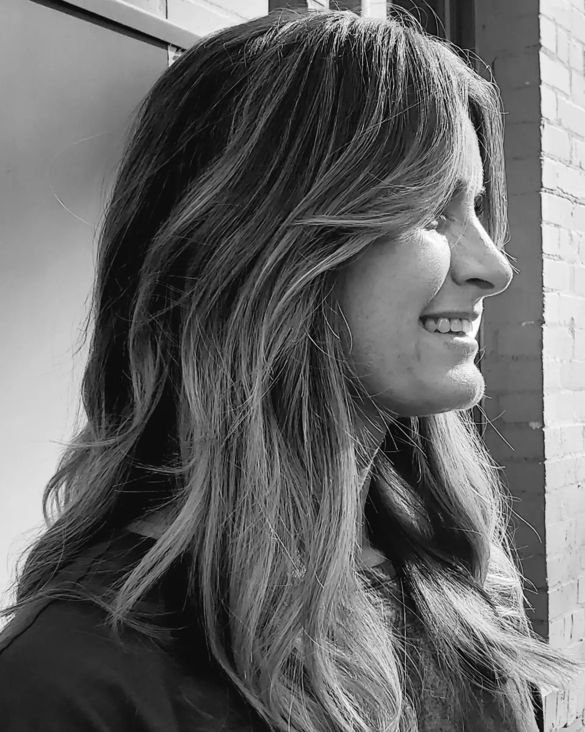 Long layered haircut featuring textured ends and soft face-framing curtain layers. 1