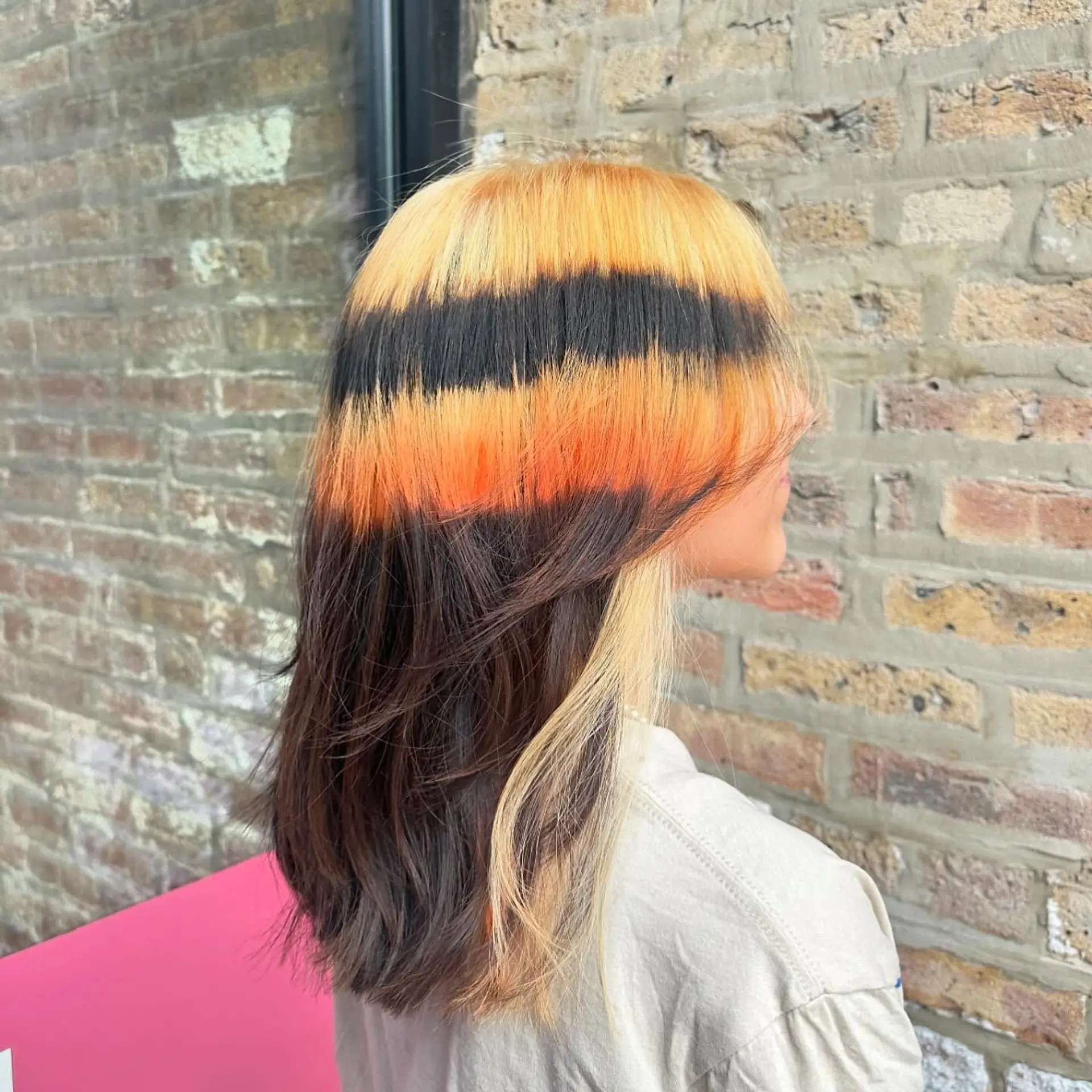 Medium straight hair with bold chunky money piece highlights, featuring contrasting colors. 2