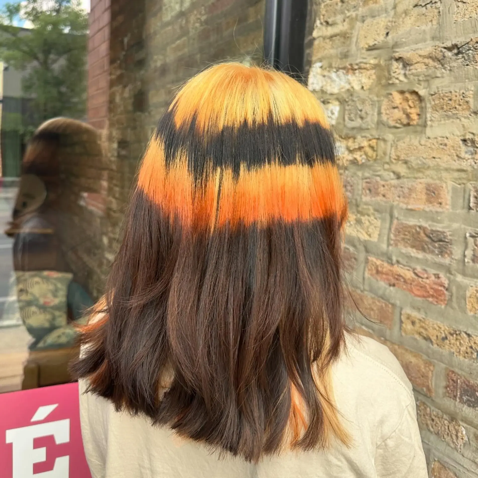 Medium straight hair with bold chunky money piece highlights, featuring contrasting colors. 4