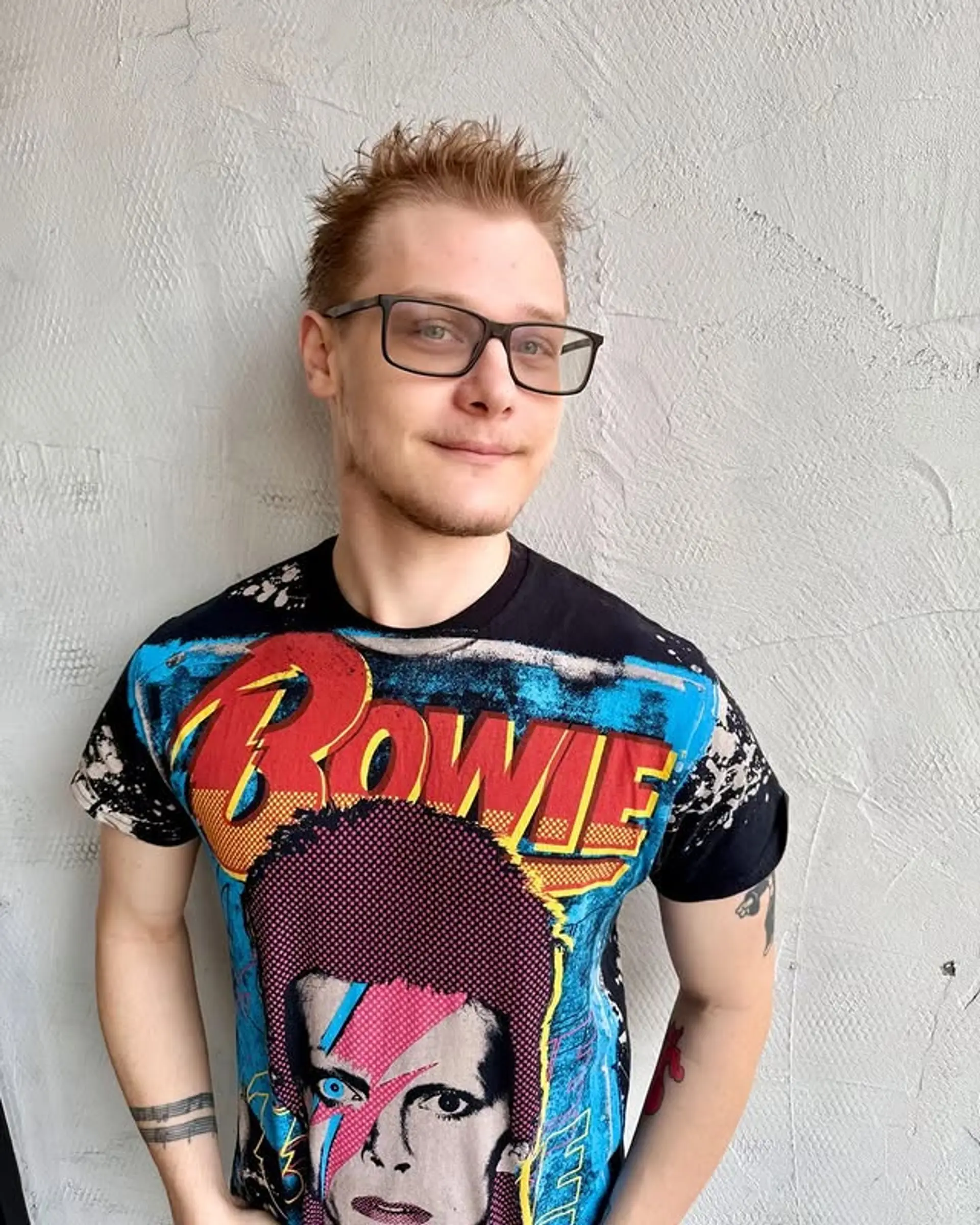 A short, textured haircut with a spiky top. 1