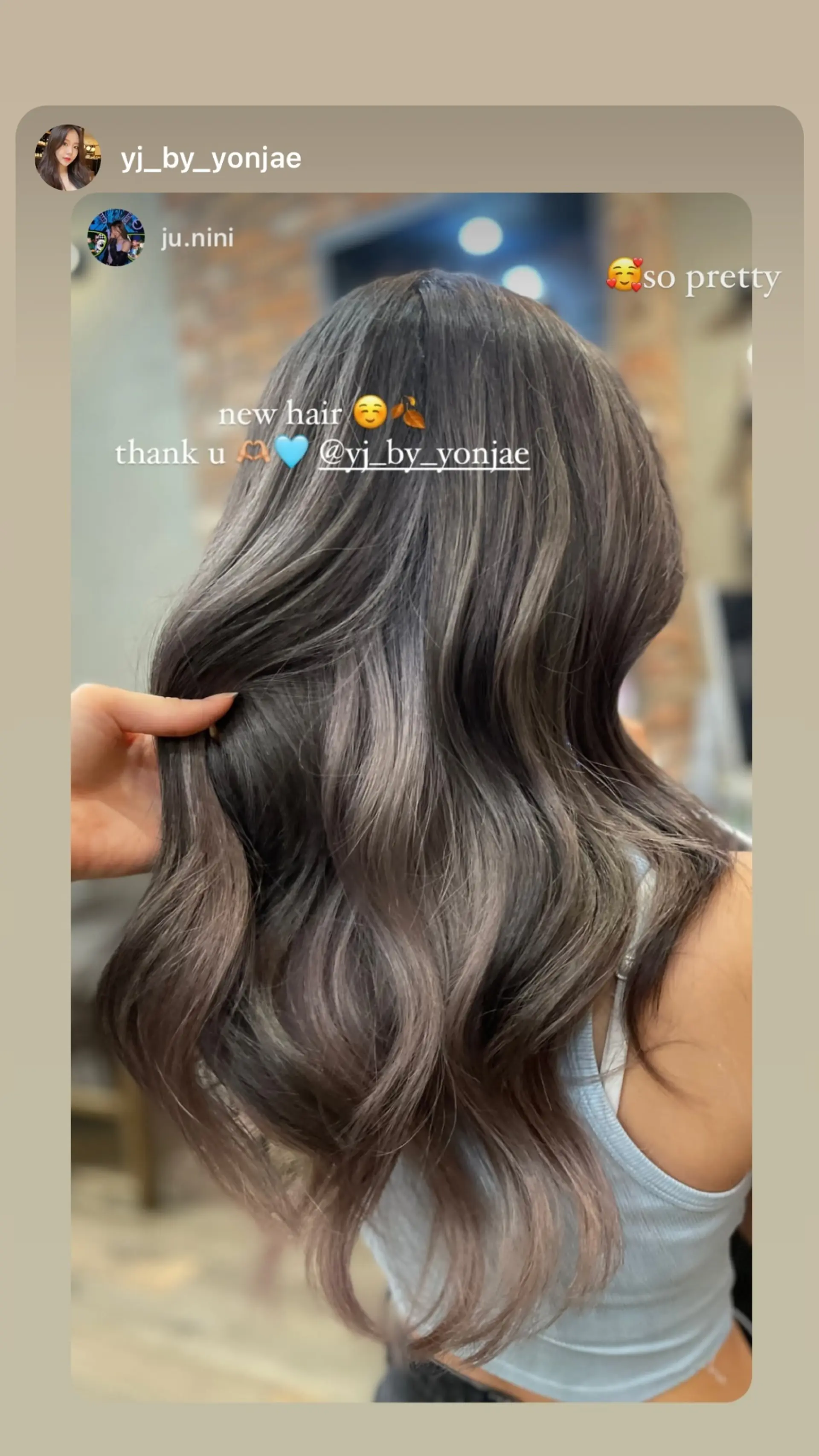 Long wavy hairstyle with a smoky ombre effect, blending ash brown and gray tones for a trendy look. 1