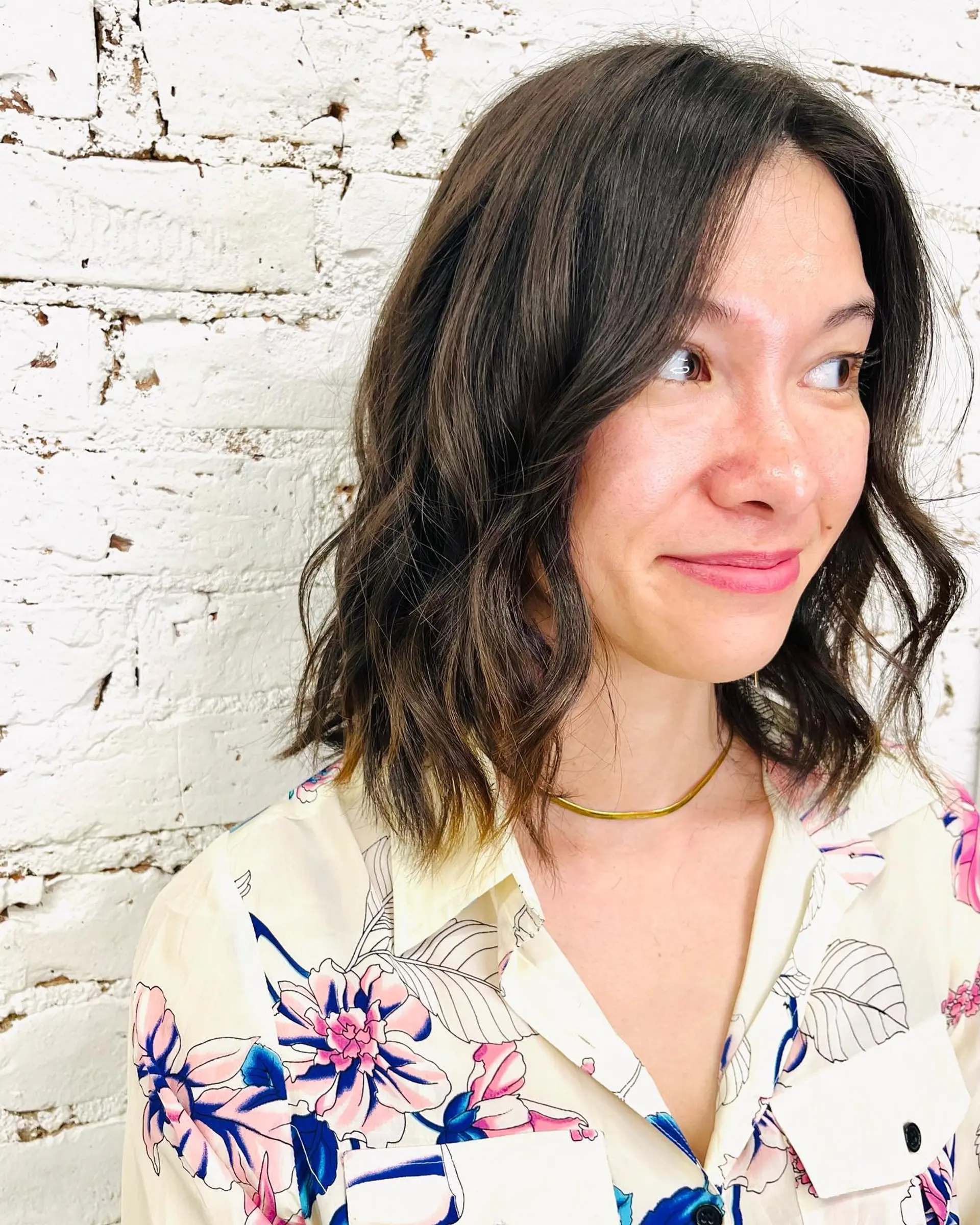 A collarbone-skimming medium bob styled with relaxed, tousled waves. 1